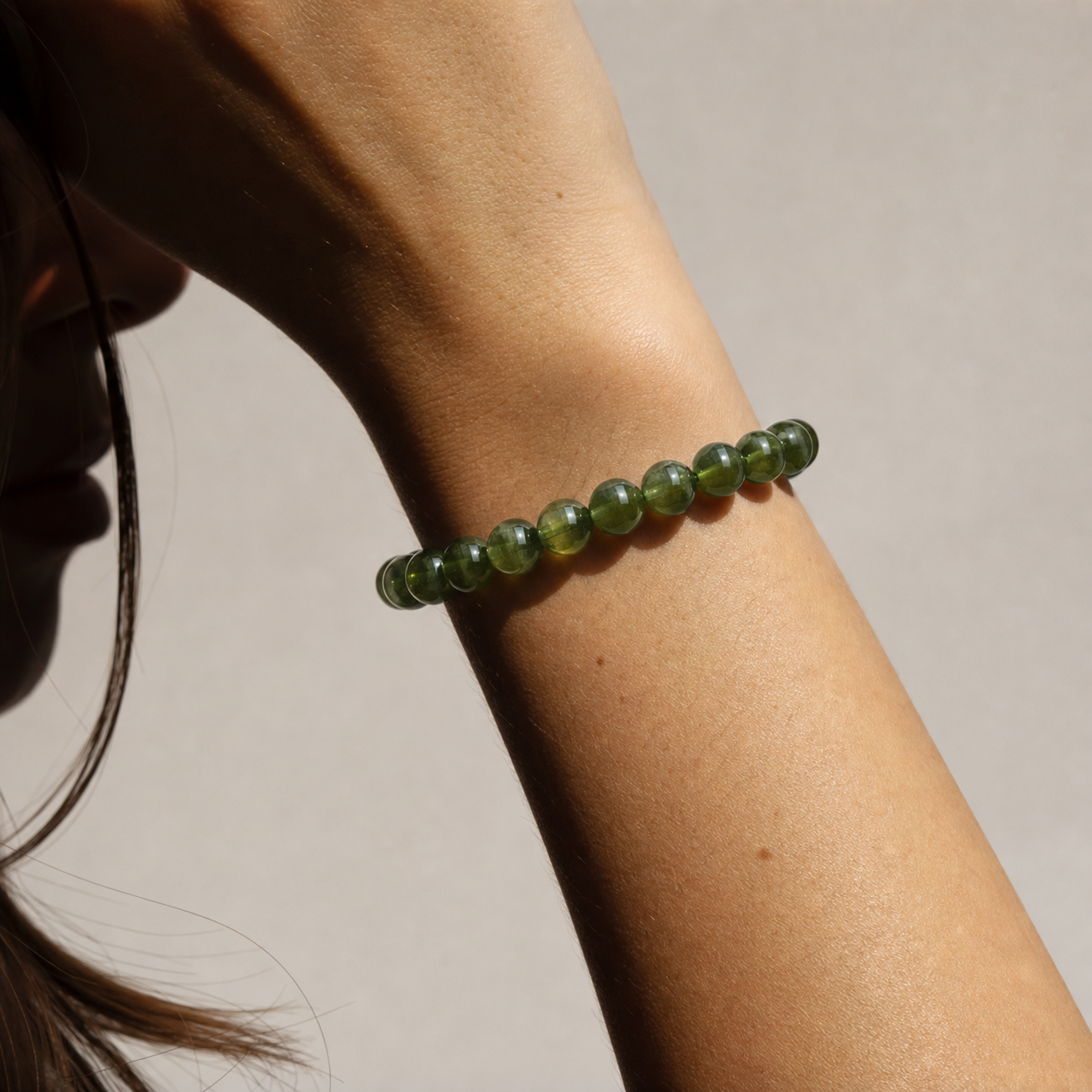 Close wrist detail of Green Apatite
