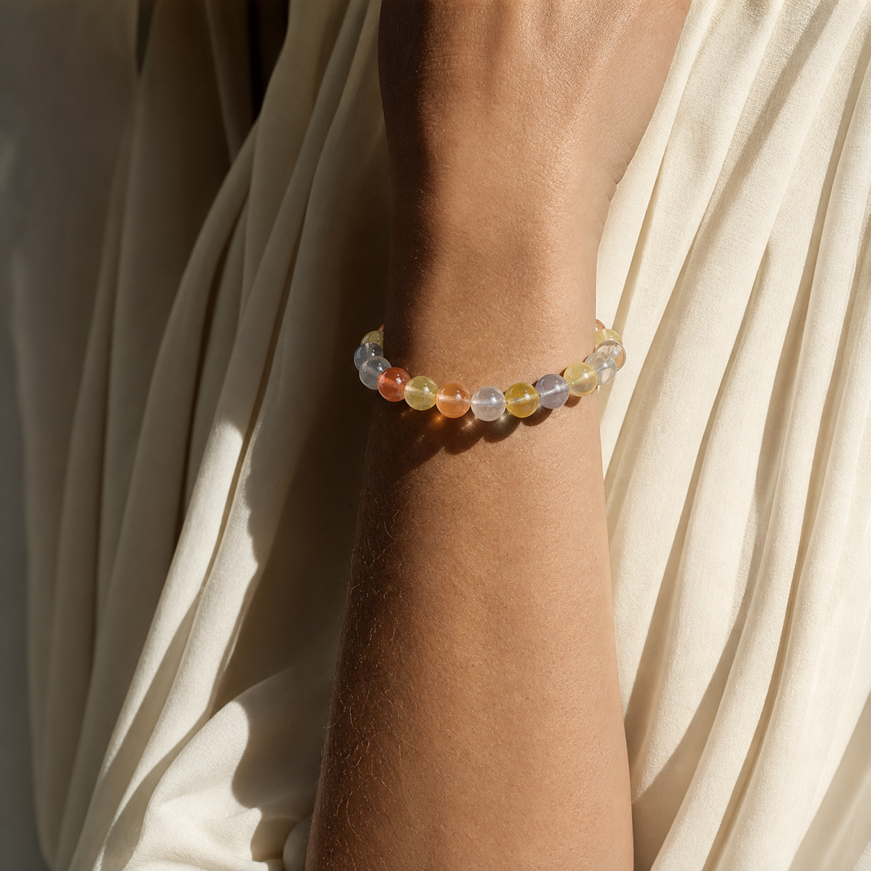 Close wrist detail of Multicolor Rutilated Quartz