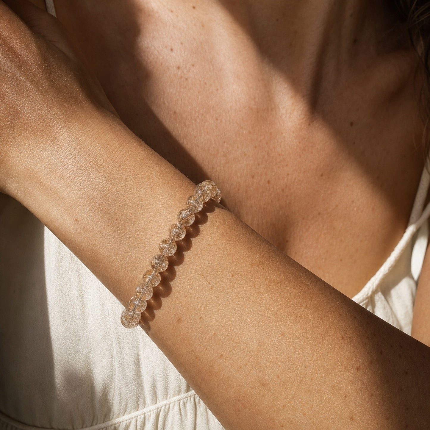 Close wrist detail of Devil's Silver Rutilated Quartz