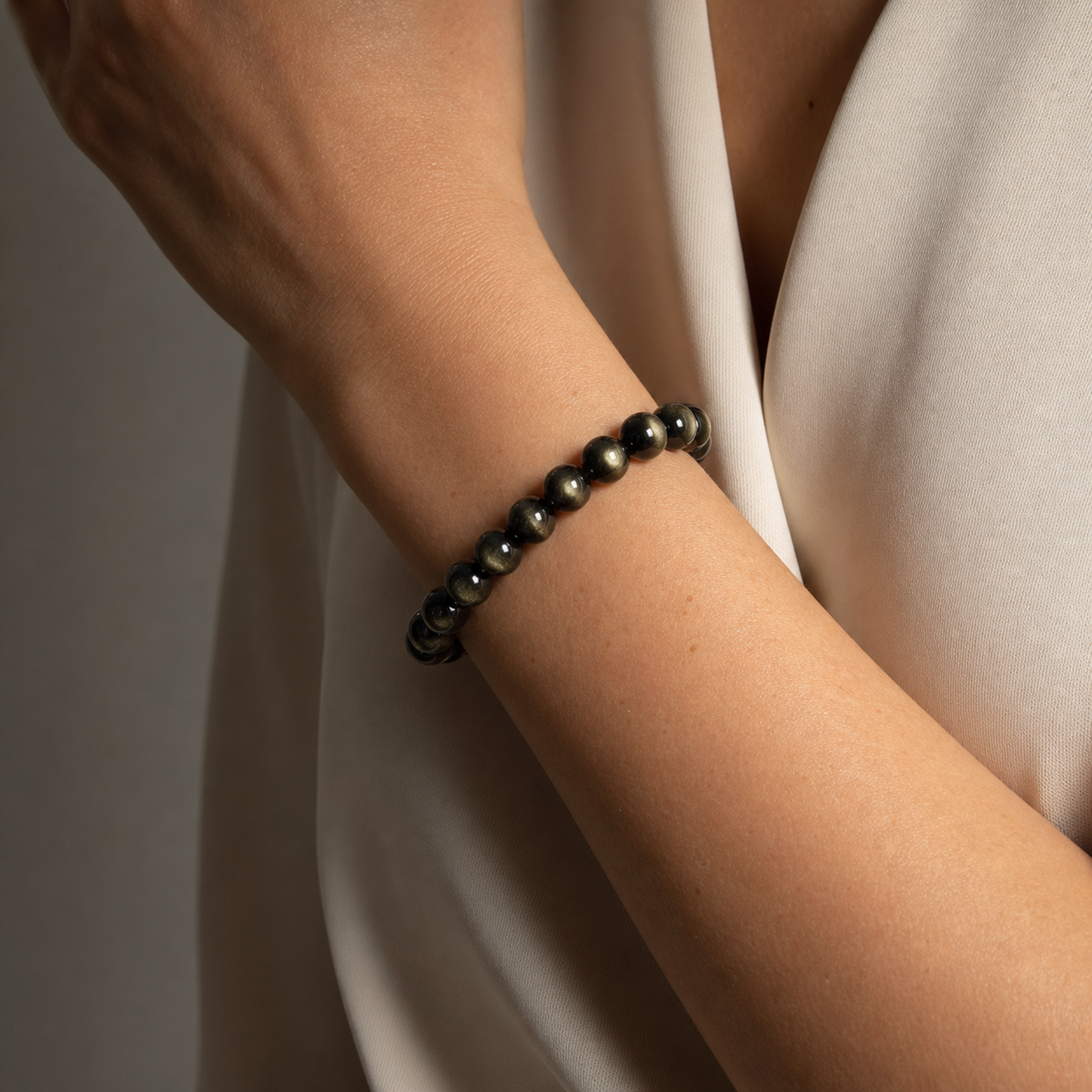 Close wrist detail of Gold Sheen Obsidian