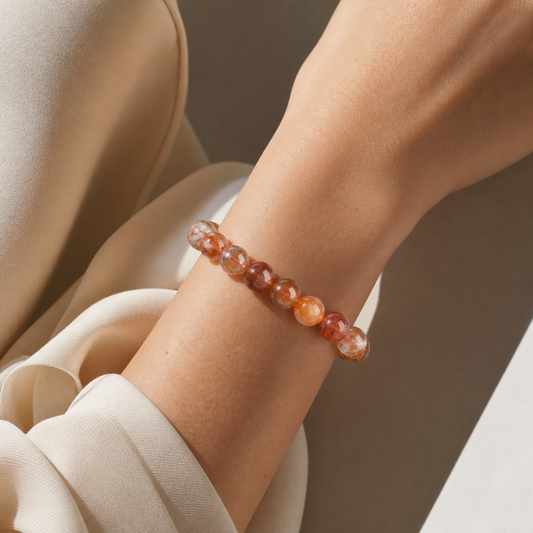Cropped wrist view of Phantom Hematoid Quartz