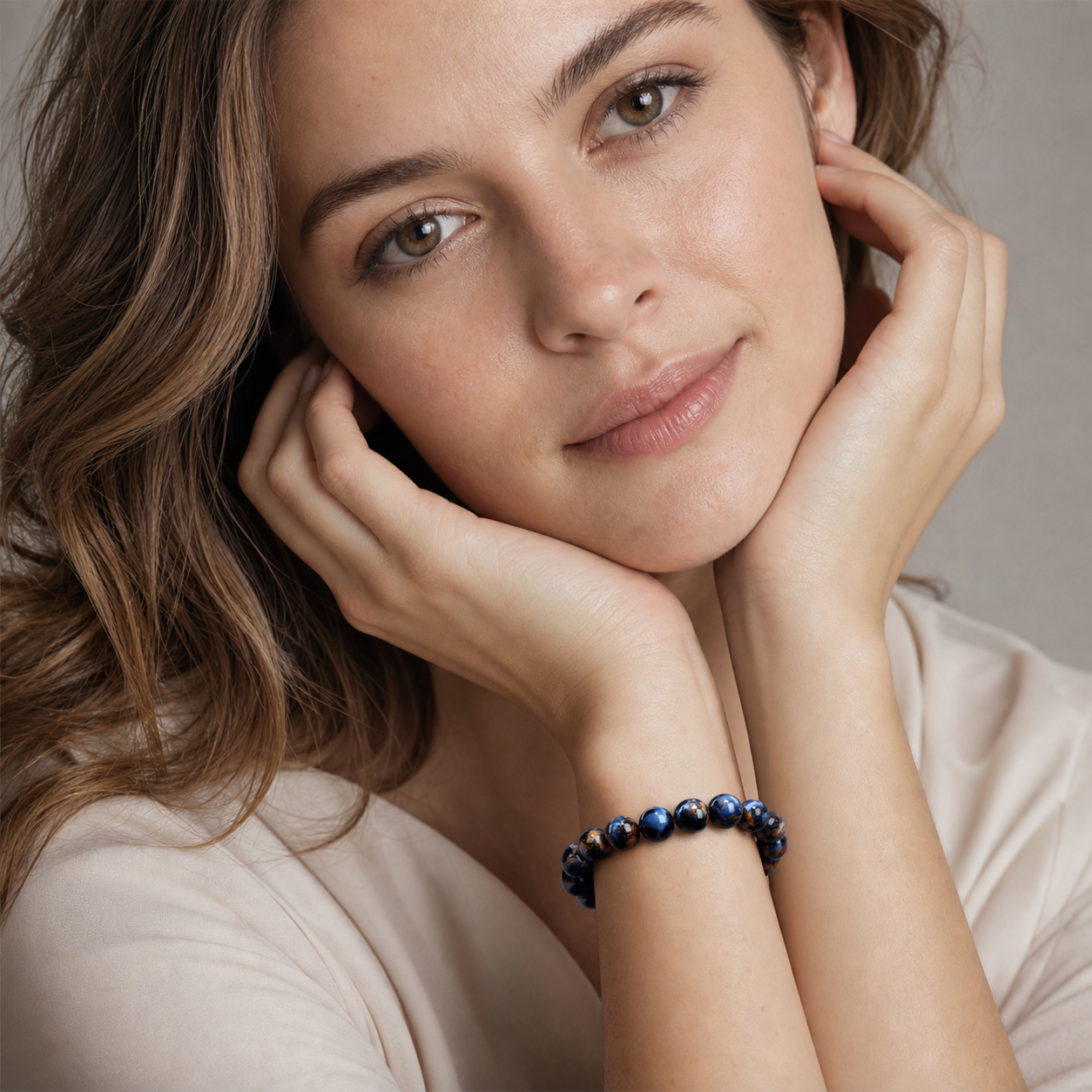 Pietersite worn by a woman with the bracelet in focus