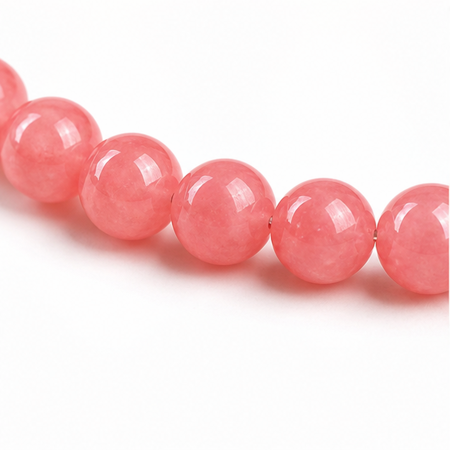 Close-up of Rhodochrosite bead colour and surface detail