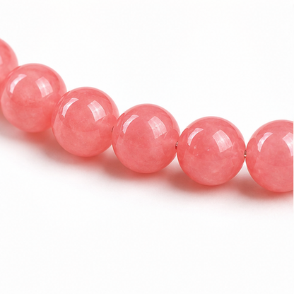 Close-up of Rhodochrosite bead colour and surface detail