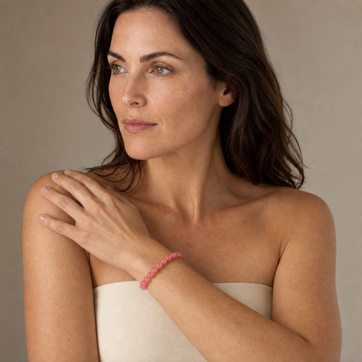 Rhodochrosite shown on a woman from a second angle