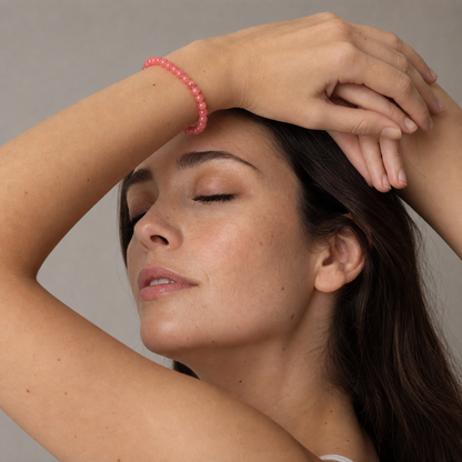 Rhodochrosite styled on a woman in a close product view