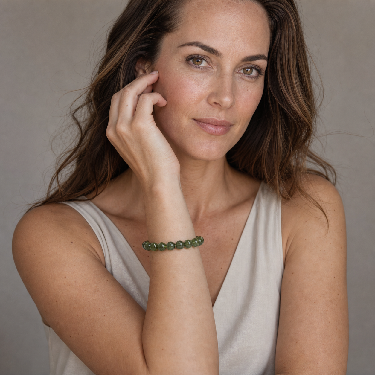 Green Apatite shown on a woman from a second angle