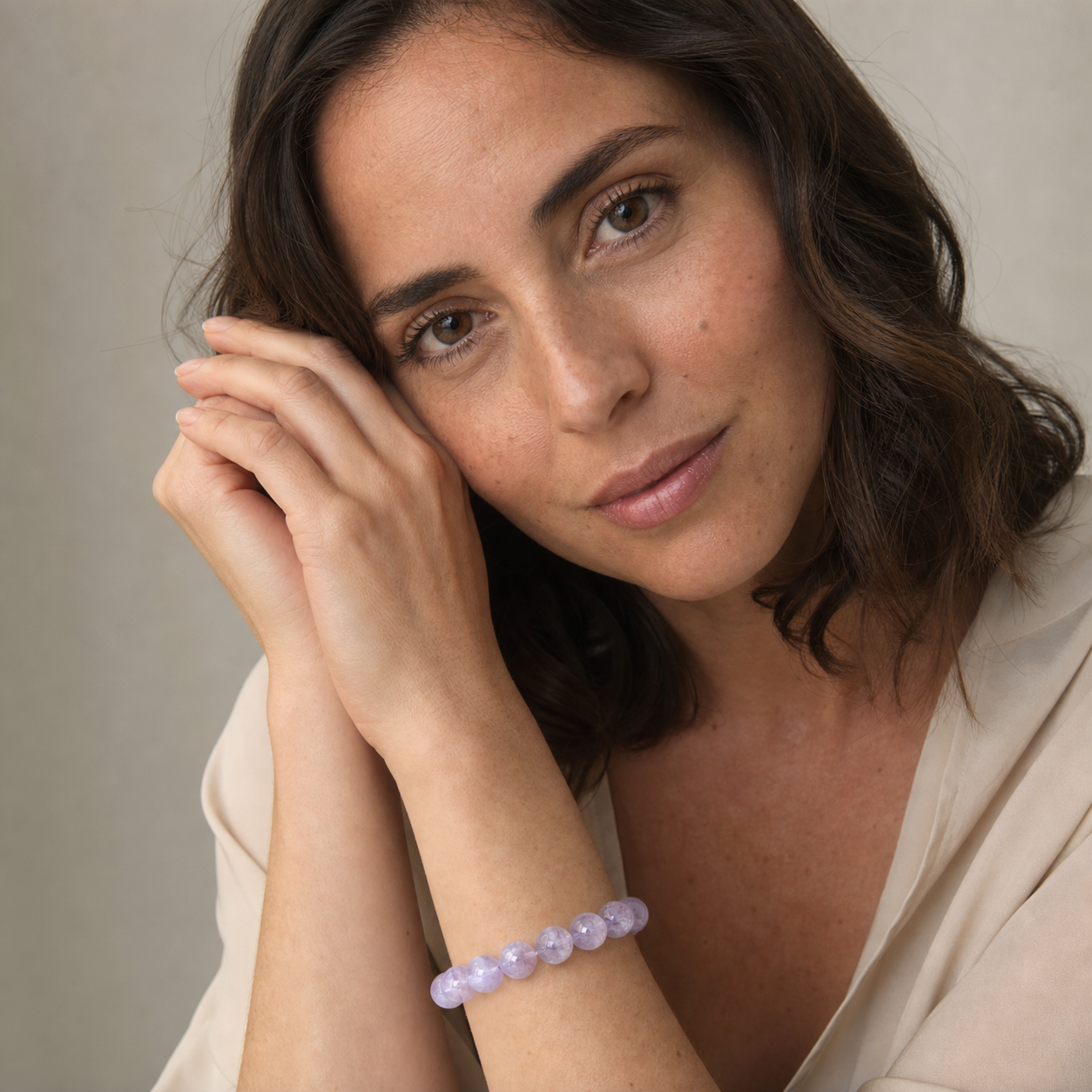 Kunzite worn by a woman with the bracelet in focus
