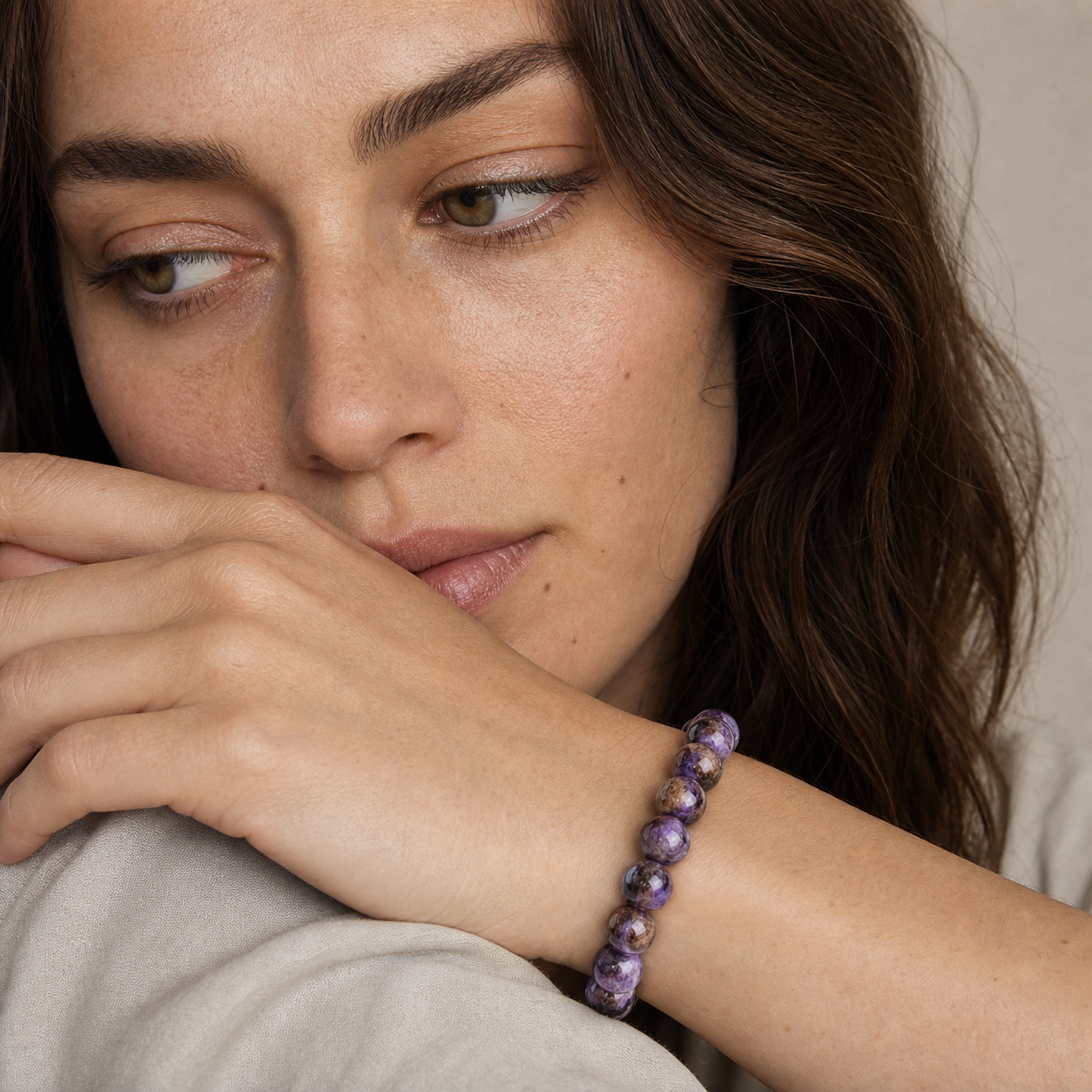 Charoite worn by a woman with the bracelet in focus