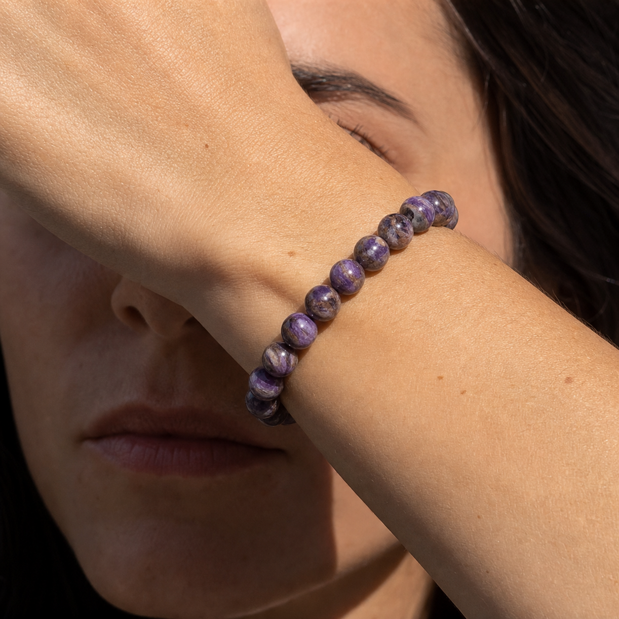 Cropped wrist view of Charoite