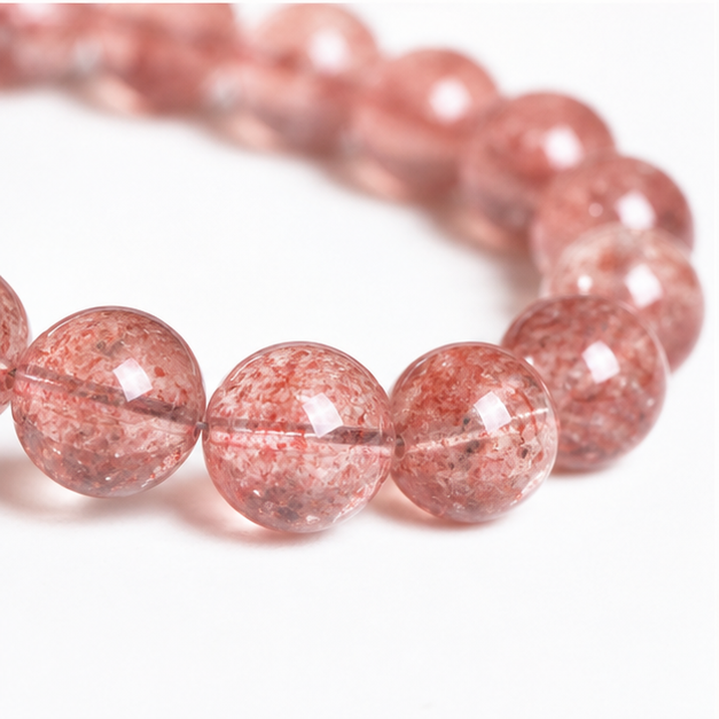 Close-up of Strawberry Quartz bead colour and surface detail