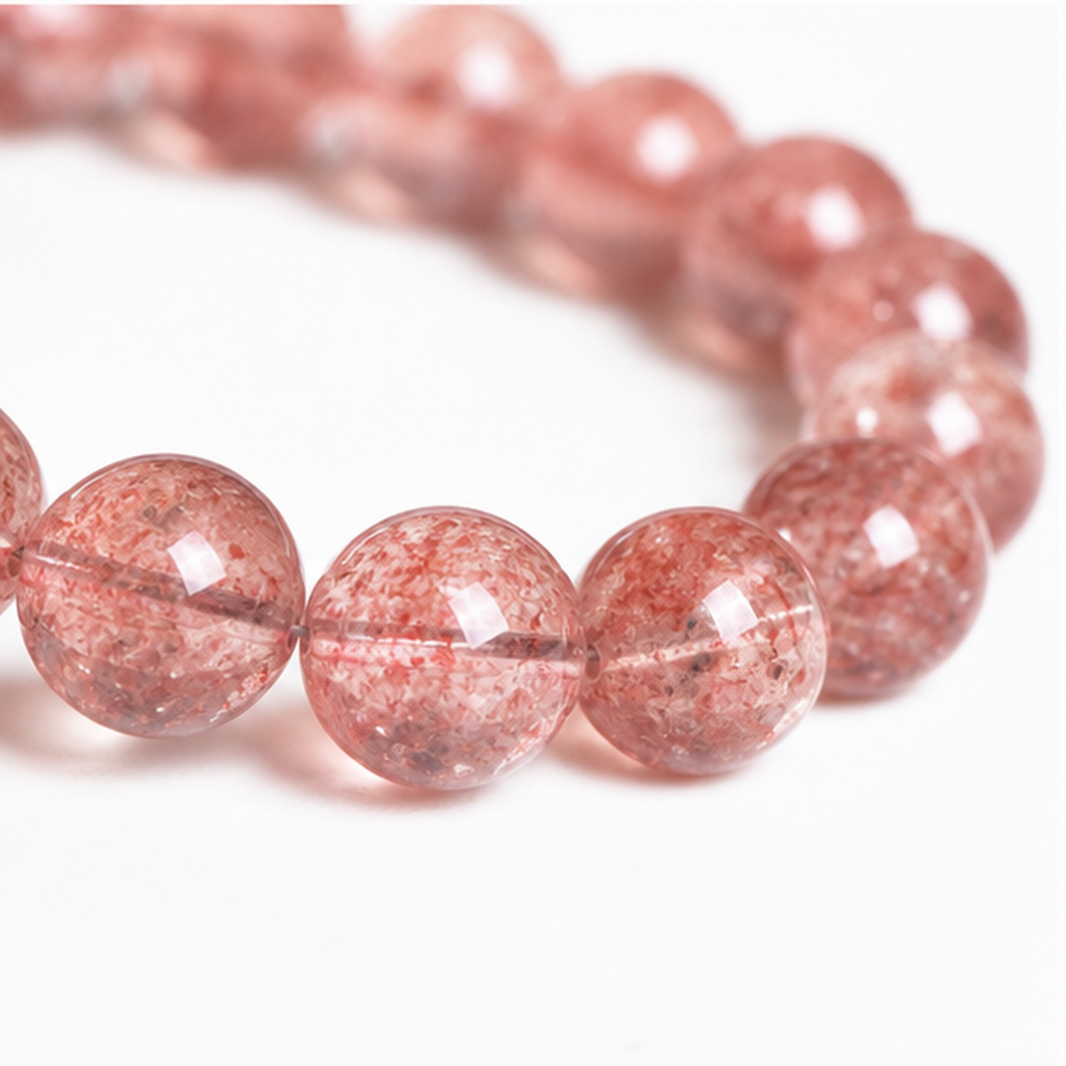 Close-up of Strawberry Quartz bead colour and surface detail