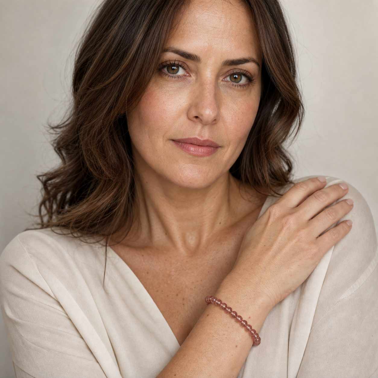 Strawberry Quartz worn by a woman with the bracelet in focus