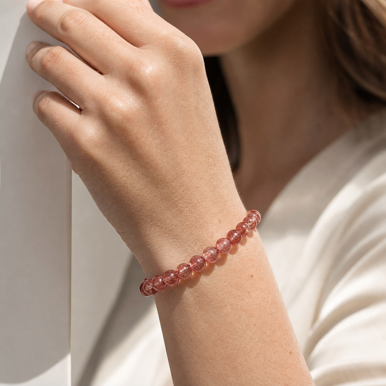 Close wrist detail of Strawberry Quartz