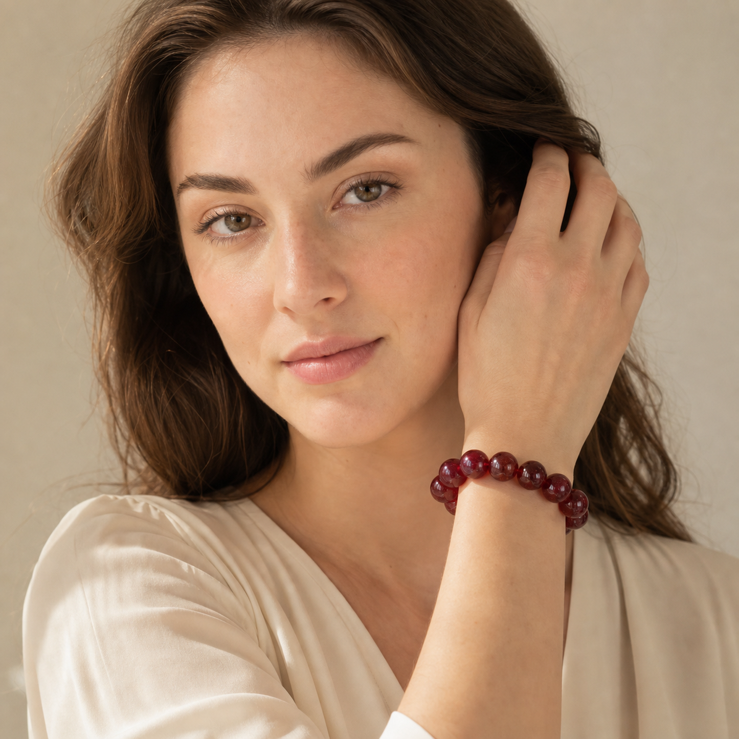 Cherry Red Strawberry Quartz worn by a woman with the bracelet in focus