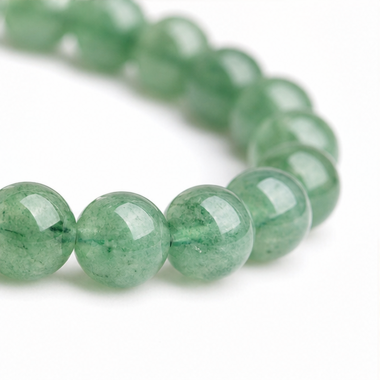 Close-up of Green Strawberry Quartz bead colour and surface detail