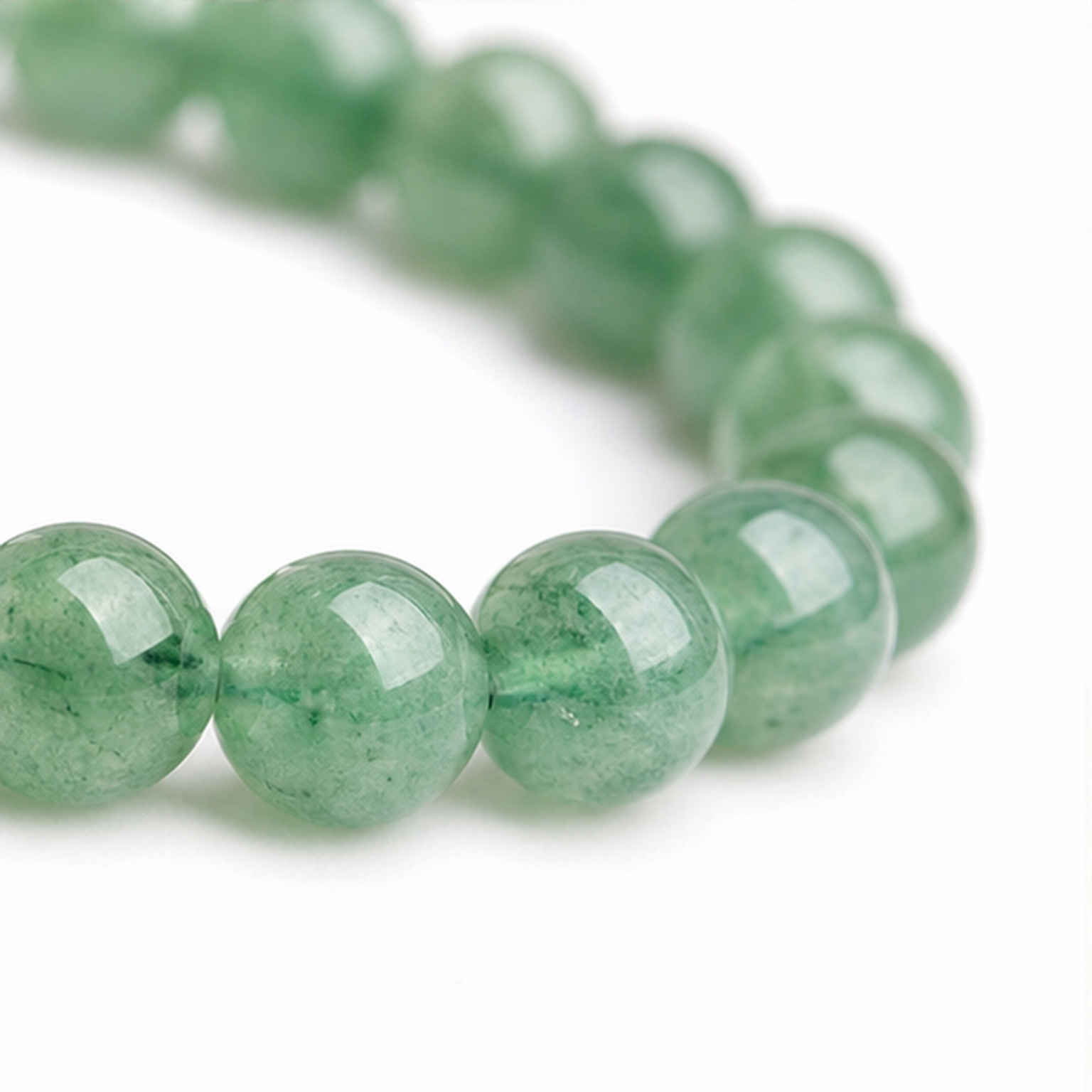 Close-up of Green Strawberry Quartz bead colour and surface detail
