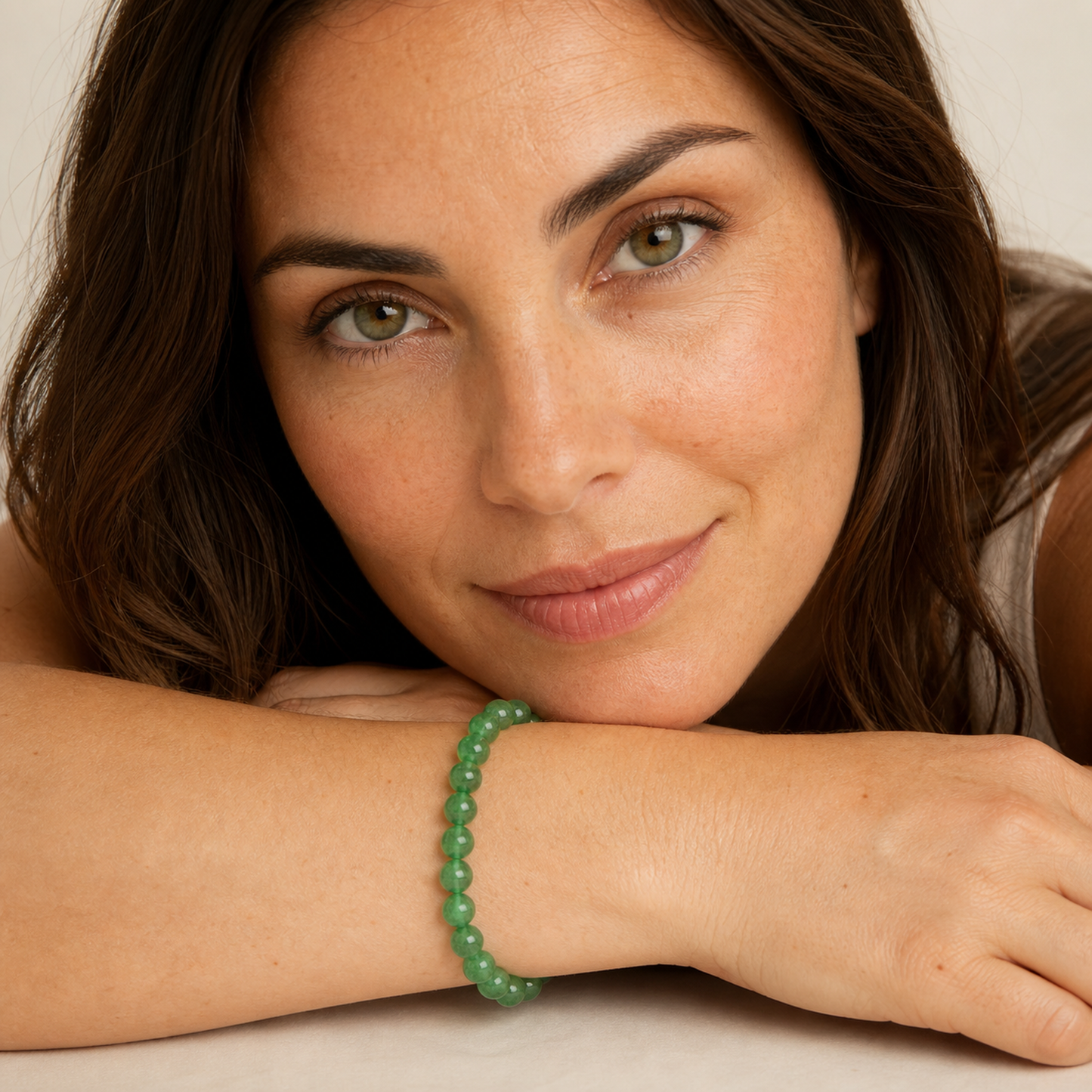 Green Strawberry Quartz worn by a woman with the bracelet in focus
