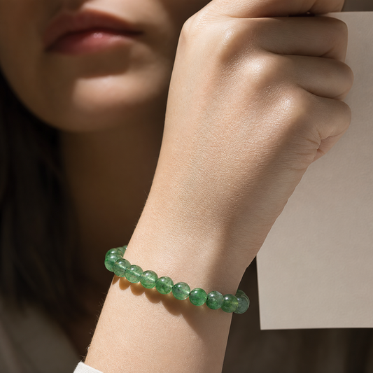 Cropped wrist view of Green Strawberry Quartz