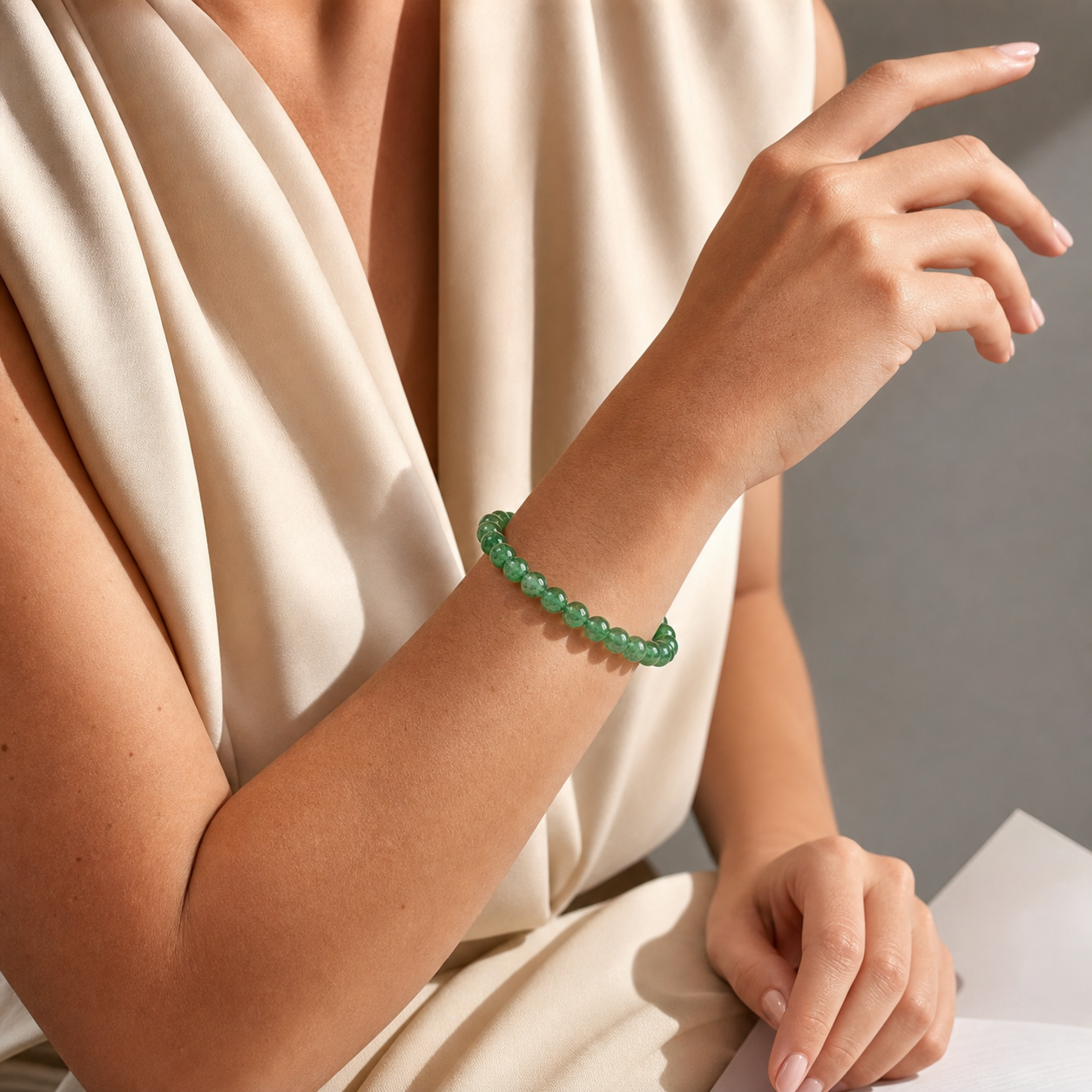 Close wrist detail of Green Strawberry Quartz
