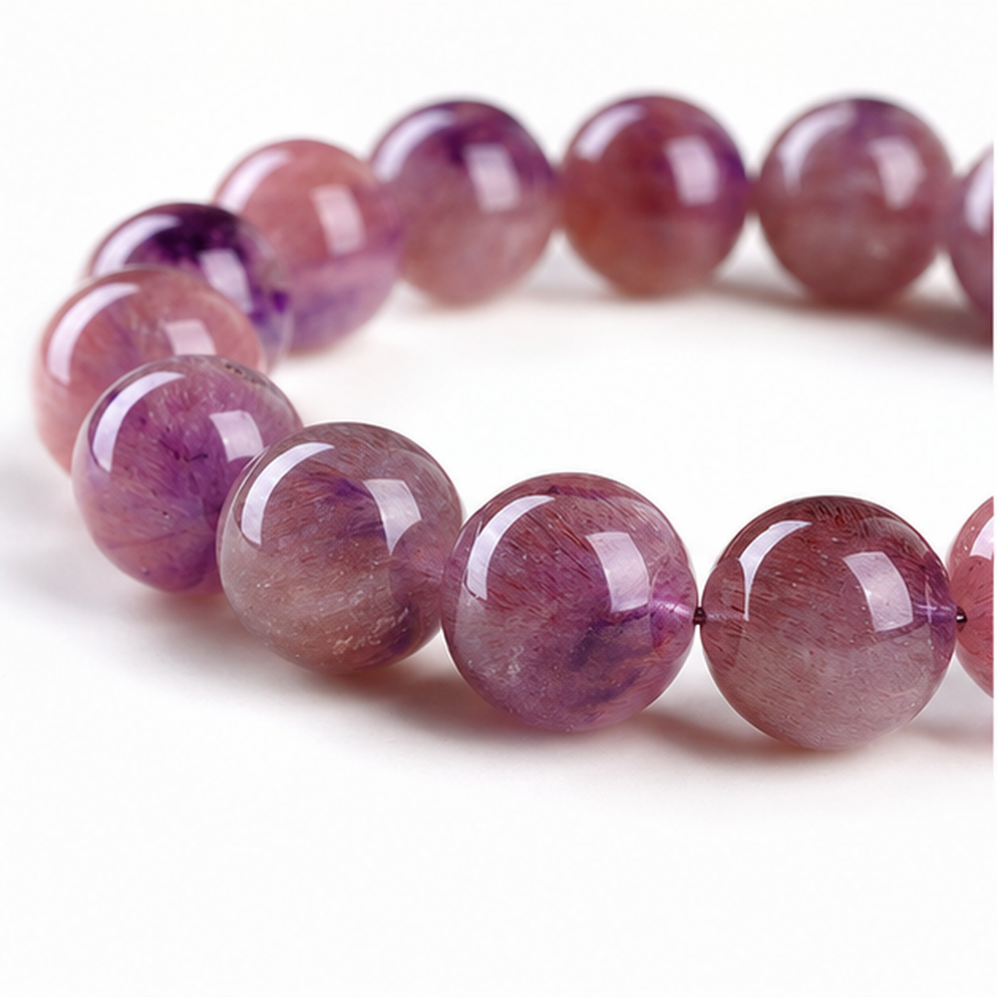 Close-up of Pink & Purple Super Seven bead colour and surface detail