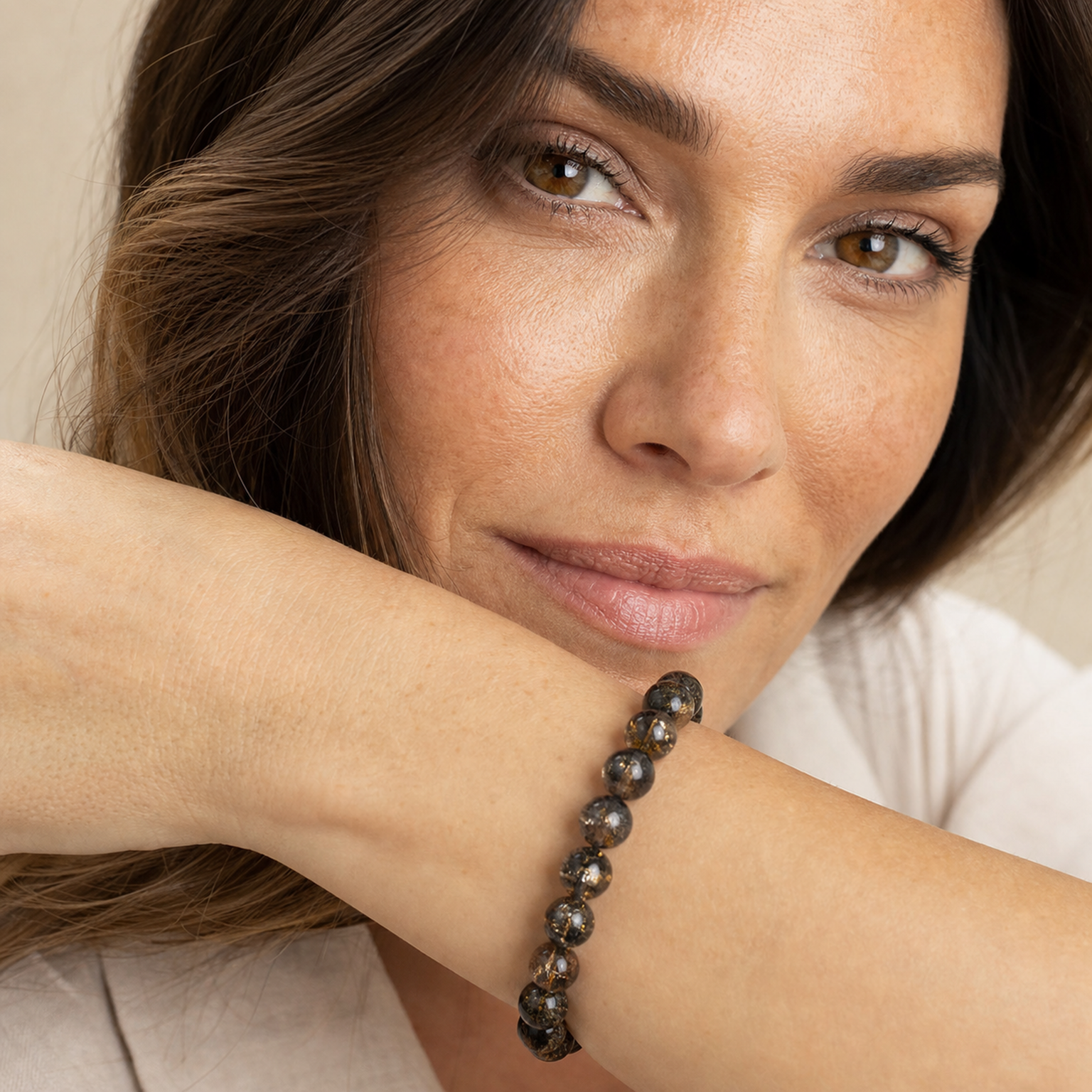 Black & Gold Super Seven styled on a woman in a close product view