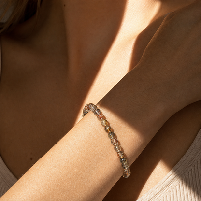 Close wrist detail of Black & Gold Super Seven