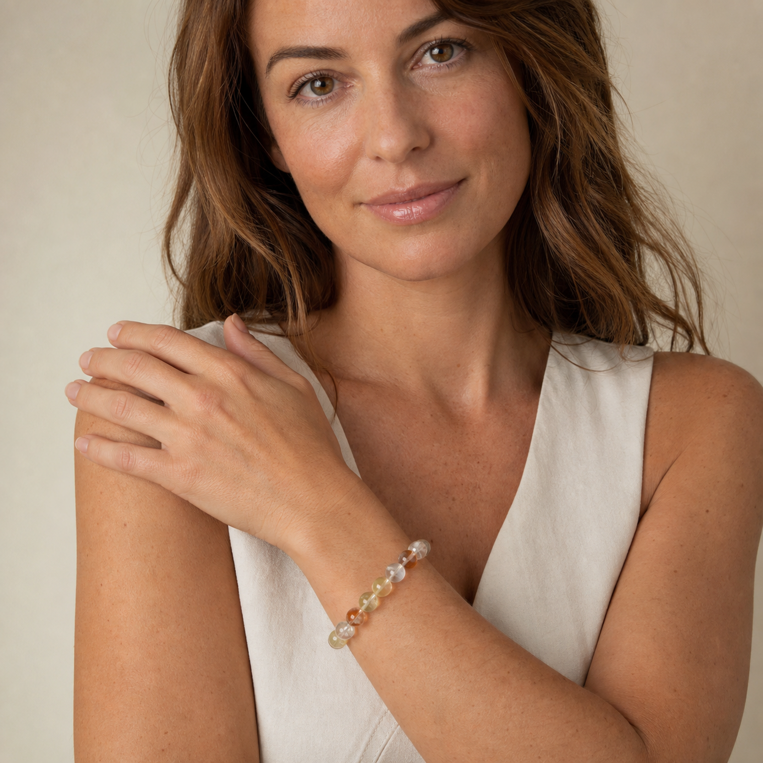 Multicolor Rutilated Quartz worn by a woman with the bracelet in focus