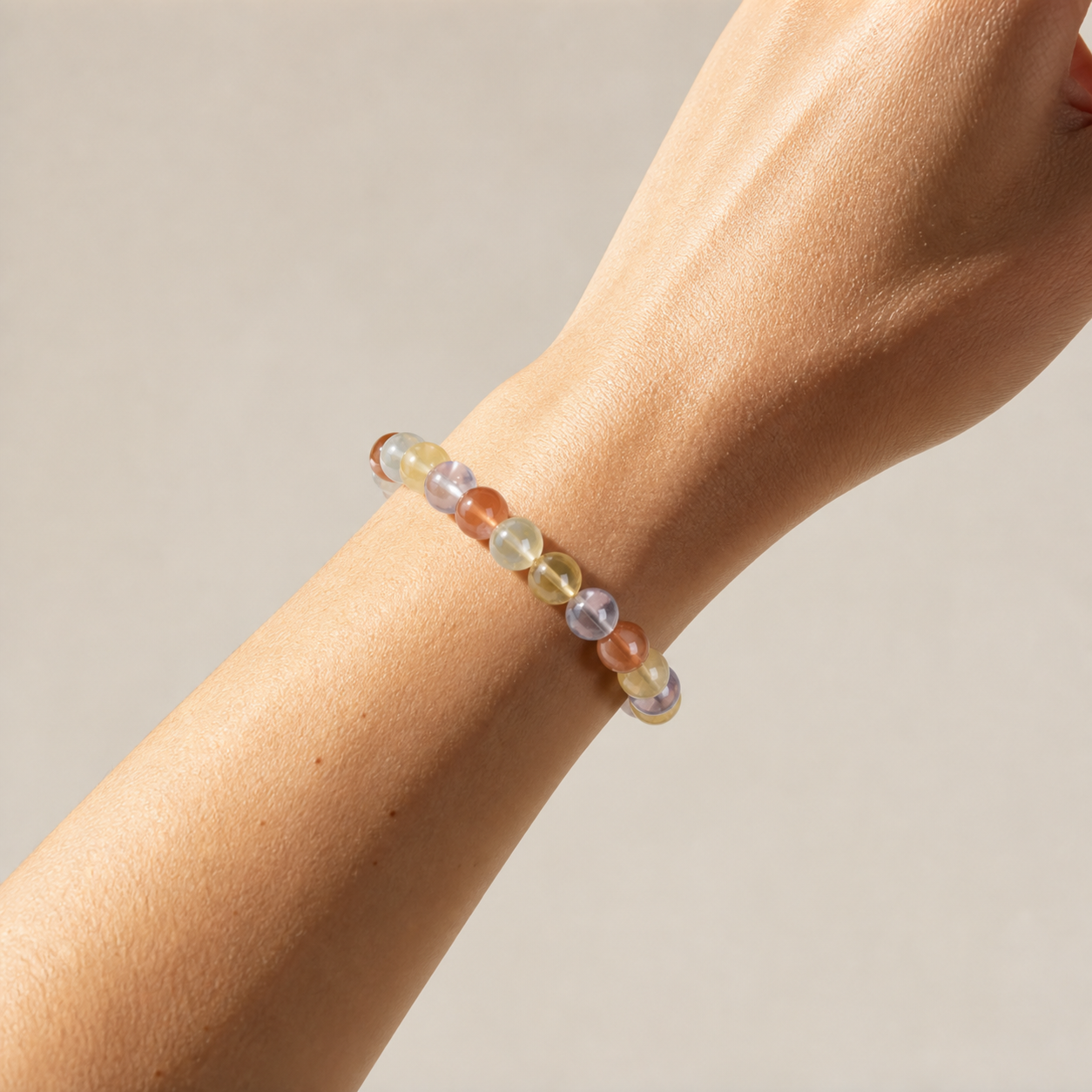 Cropped wrist view of Multicolor Rutilated Quartz
