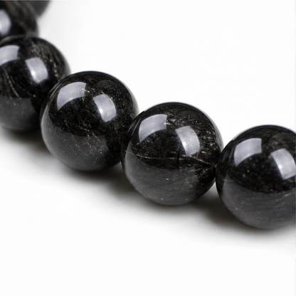 Close-up of Black Rutilated Quartz bead colour and surface detail