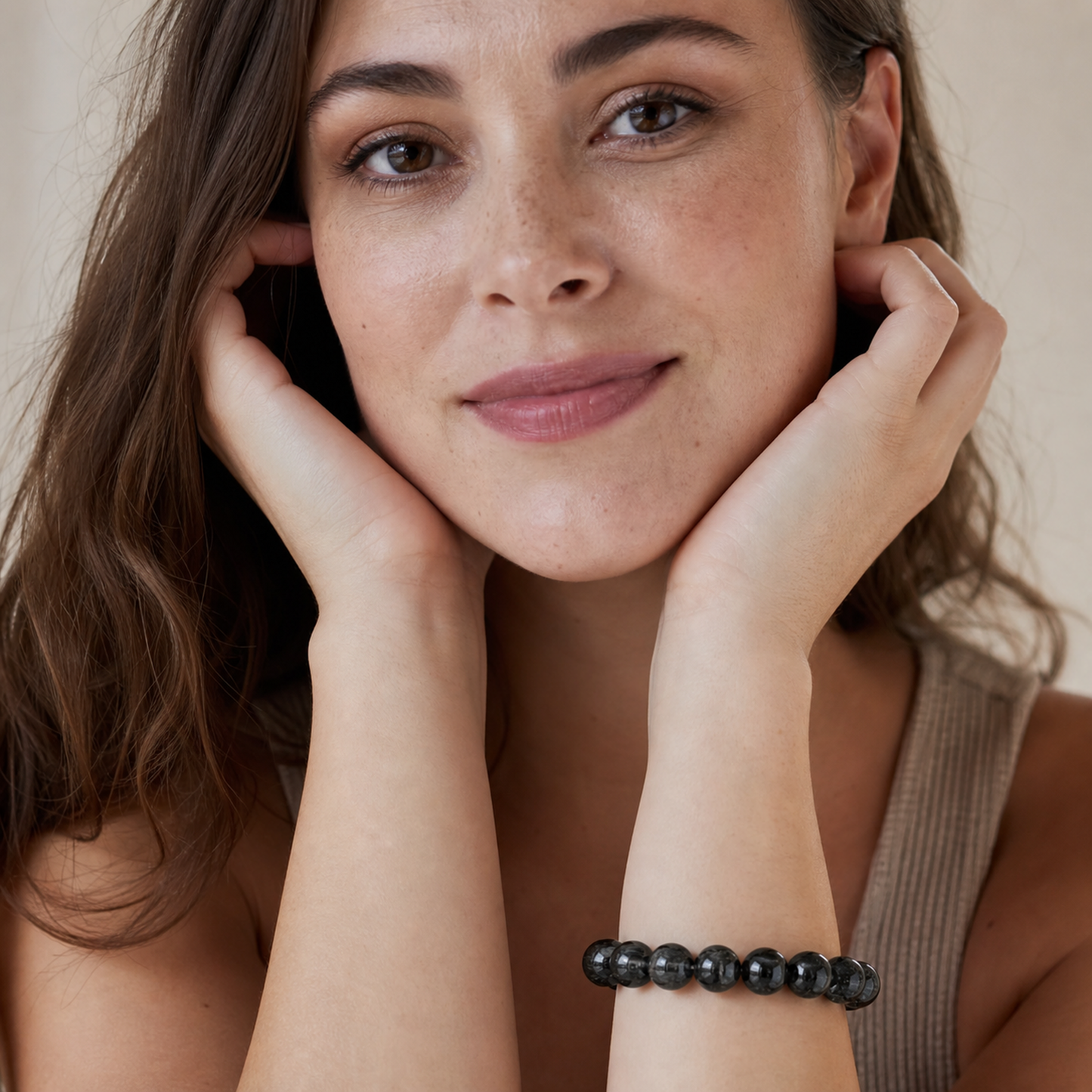 Black Rutilated Quartz worn by a woman with the bracelet in focus