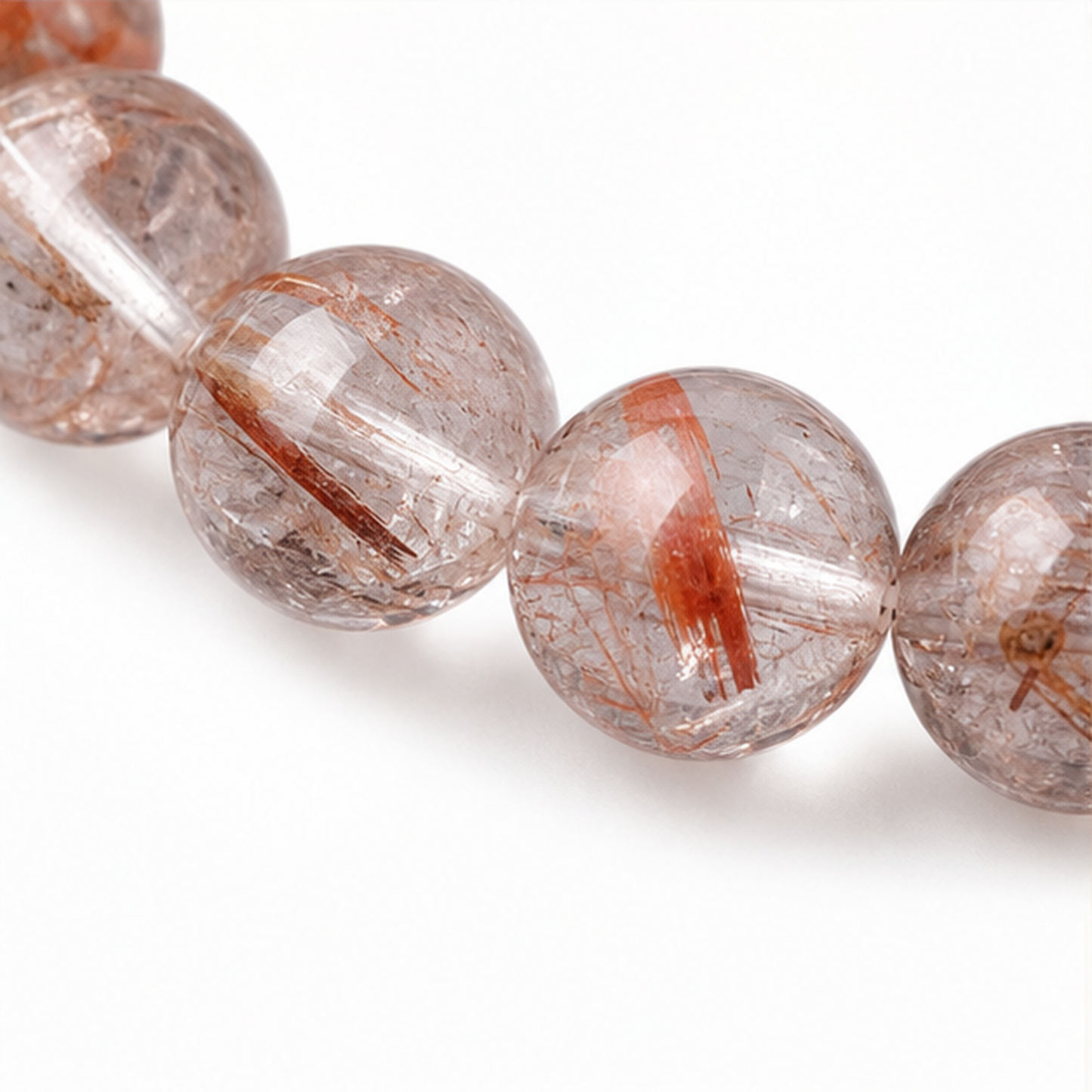 Close-up of Red Rutilated Quartz bead colour and surface detail