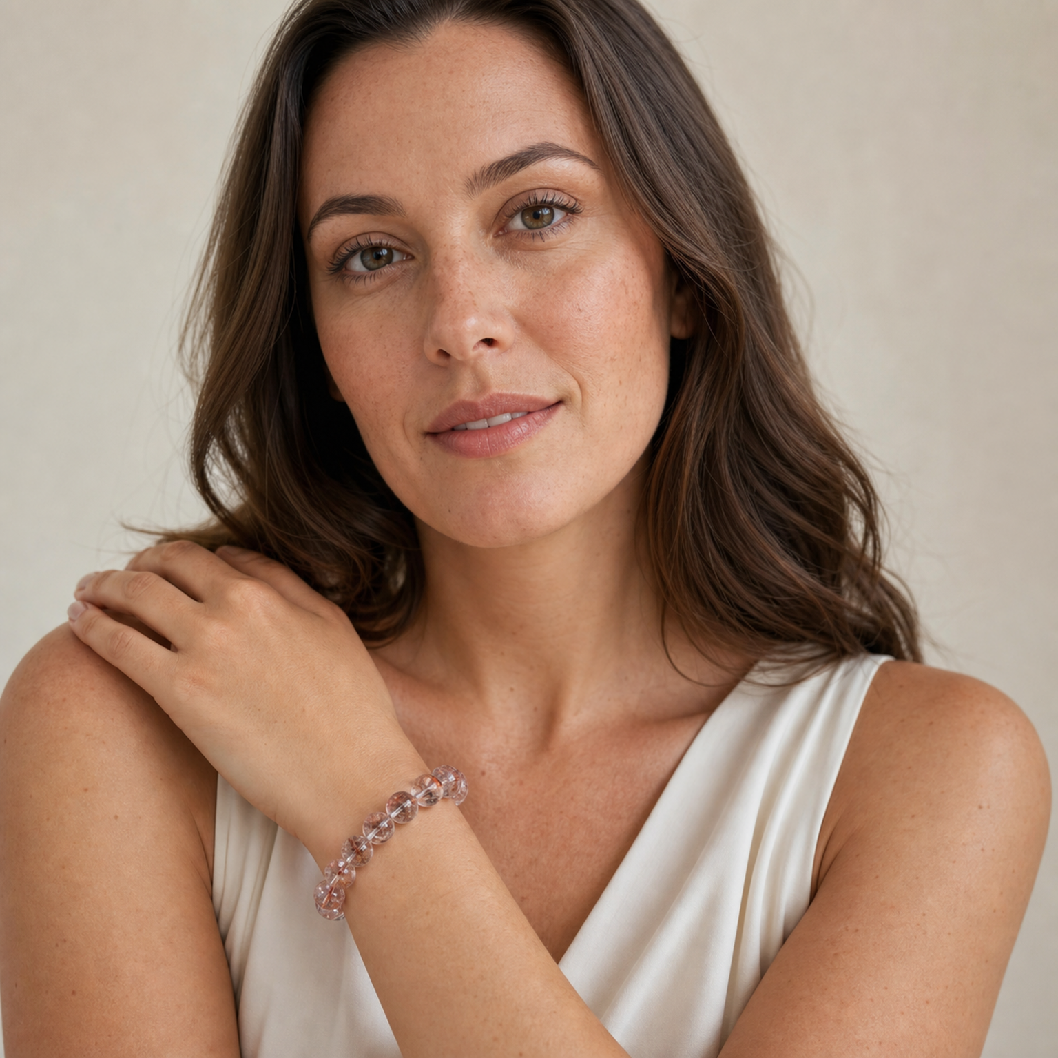 Red Rutilated Quartz worn by a woman with the bracelet in focus