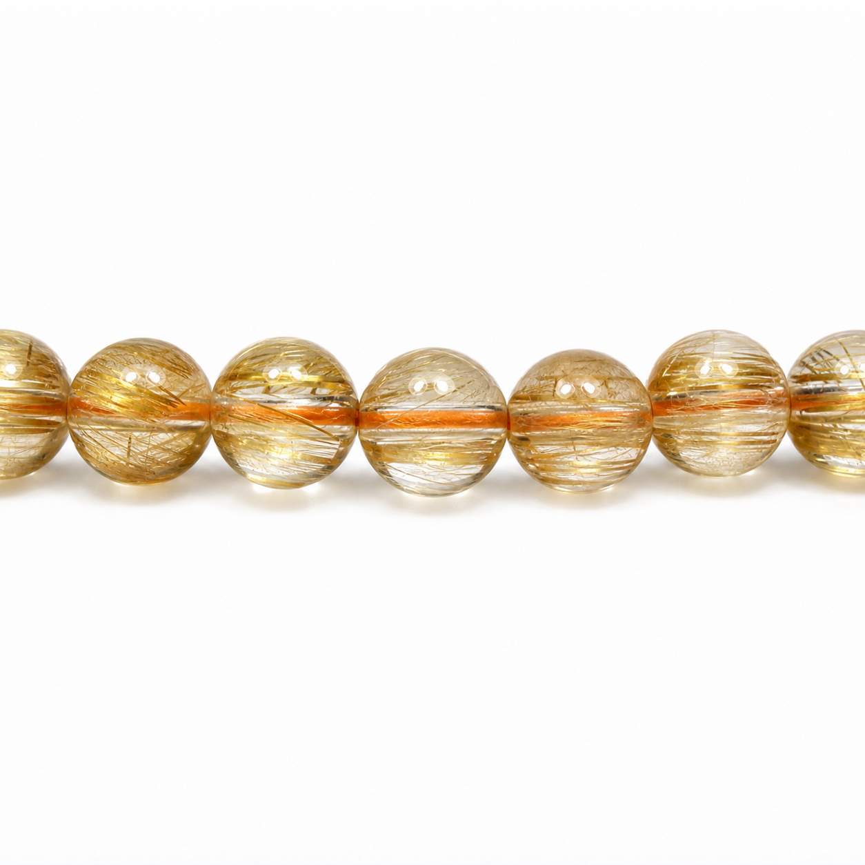 Close-up of Golden Rutilated Quartz bead colour and surface detail