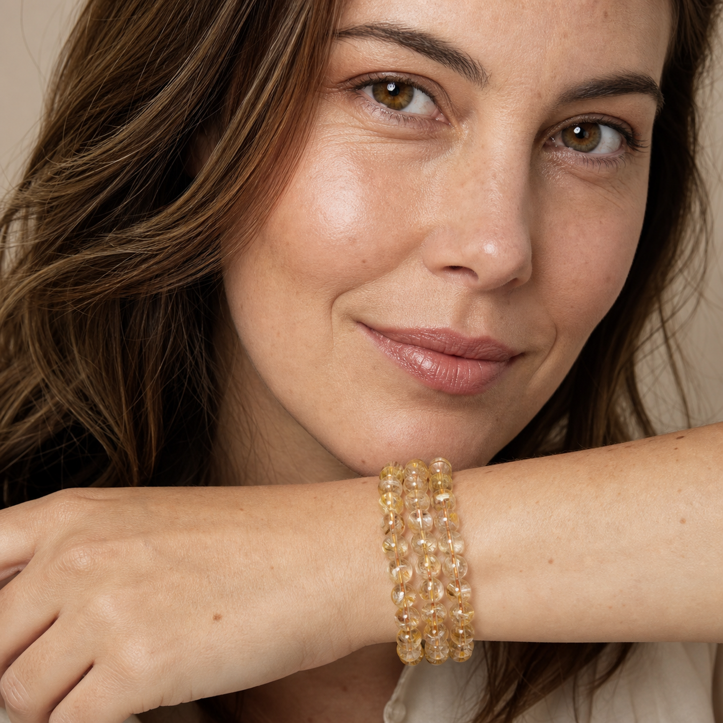Golden Rutilated Quartz styled on a woman in a close product view