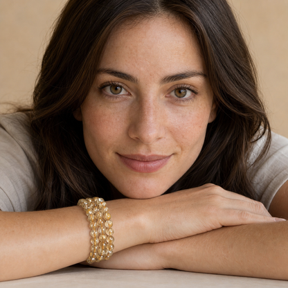 Golden Rutilated Quartz worn by a woman with the bracelet in focus