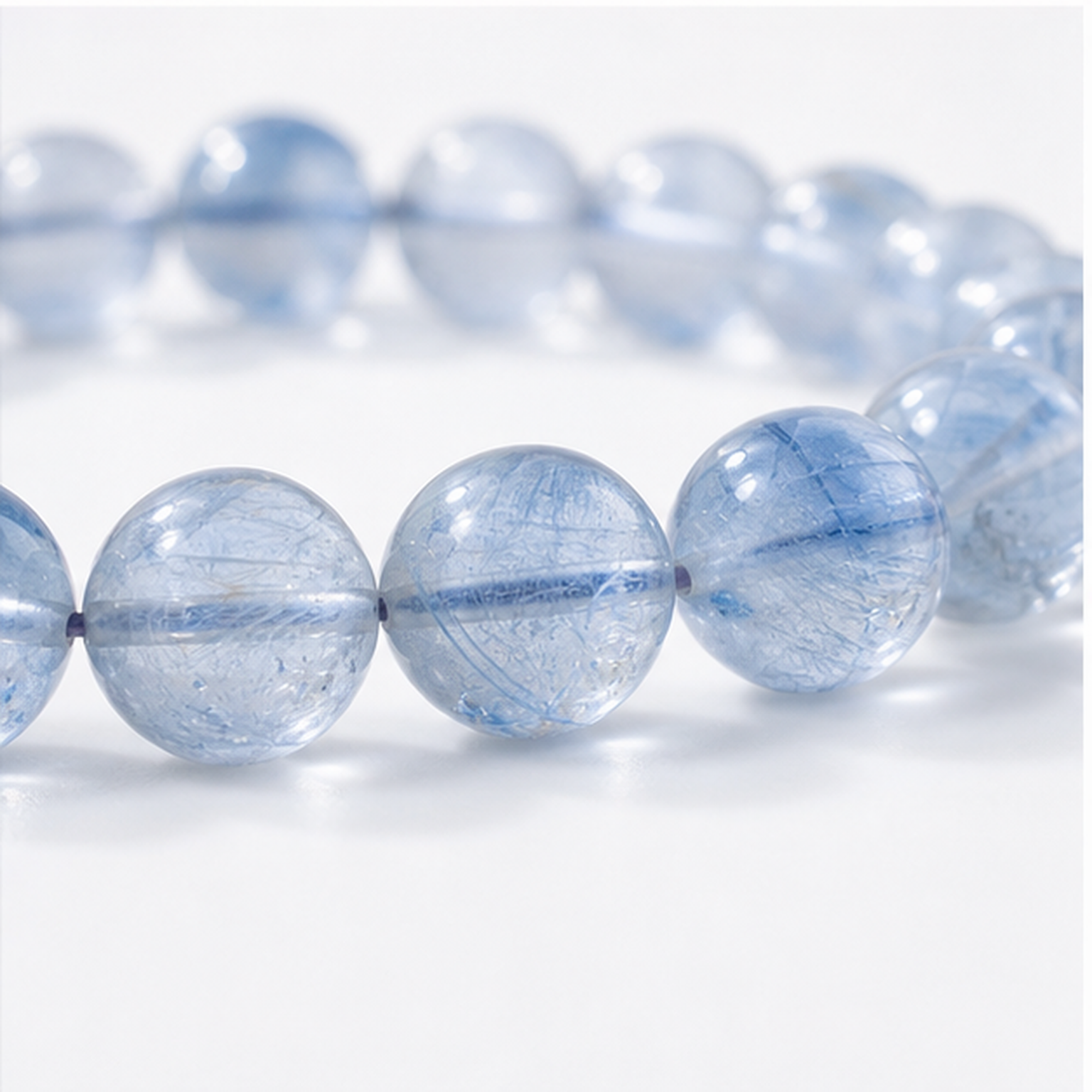 Close-up of Blue Rutilated Quartz bead colour and surface detail