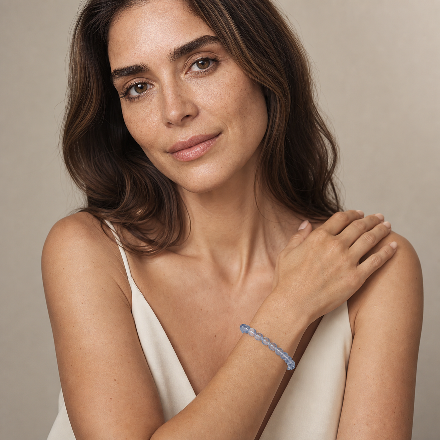 Blue Rutilated Quartz worn by a woman with the bracelet in focus