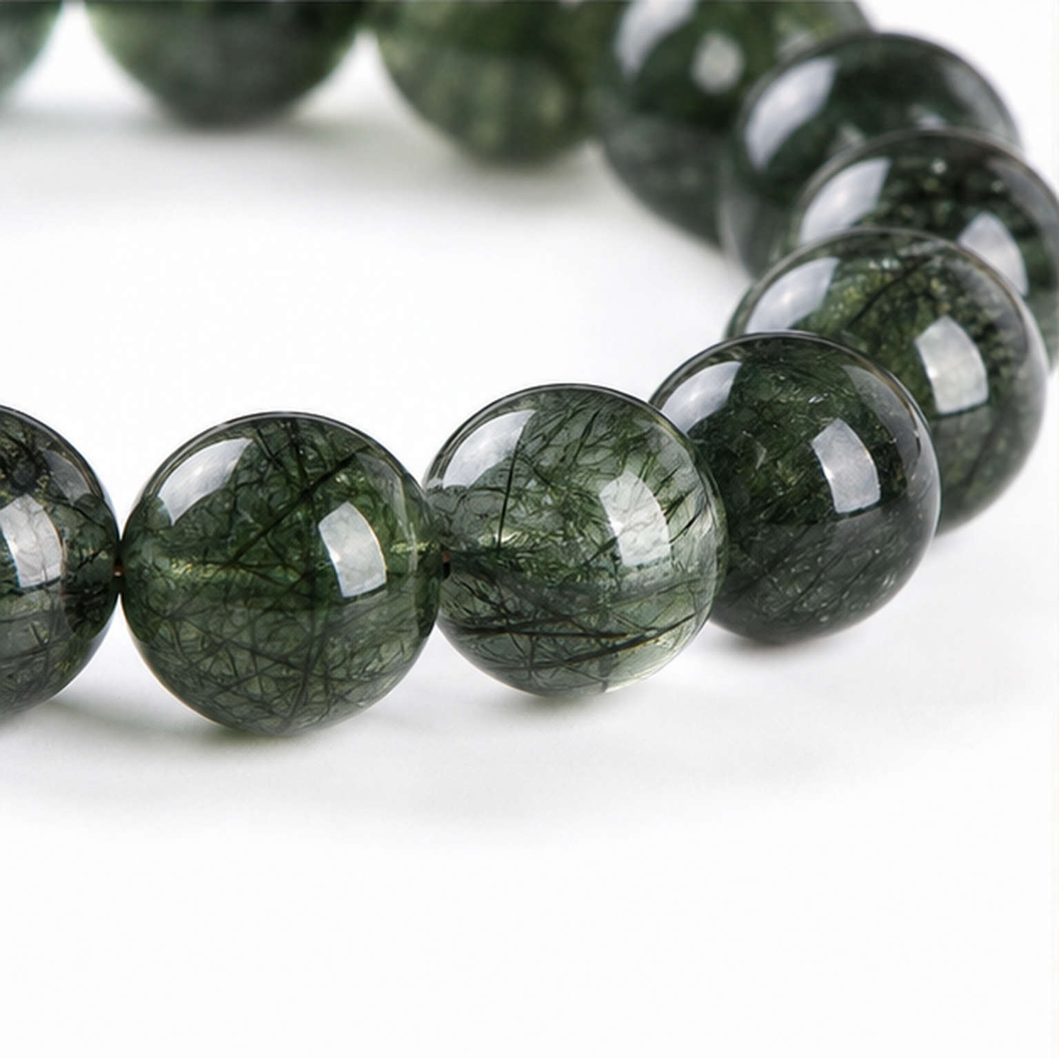 Close-up of Green Rutilated Quartz bead colour and surface detail