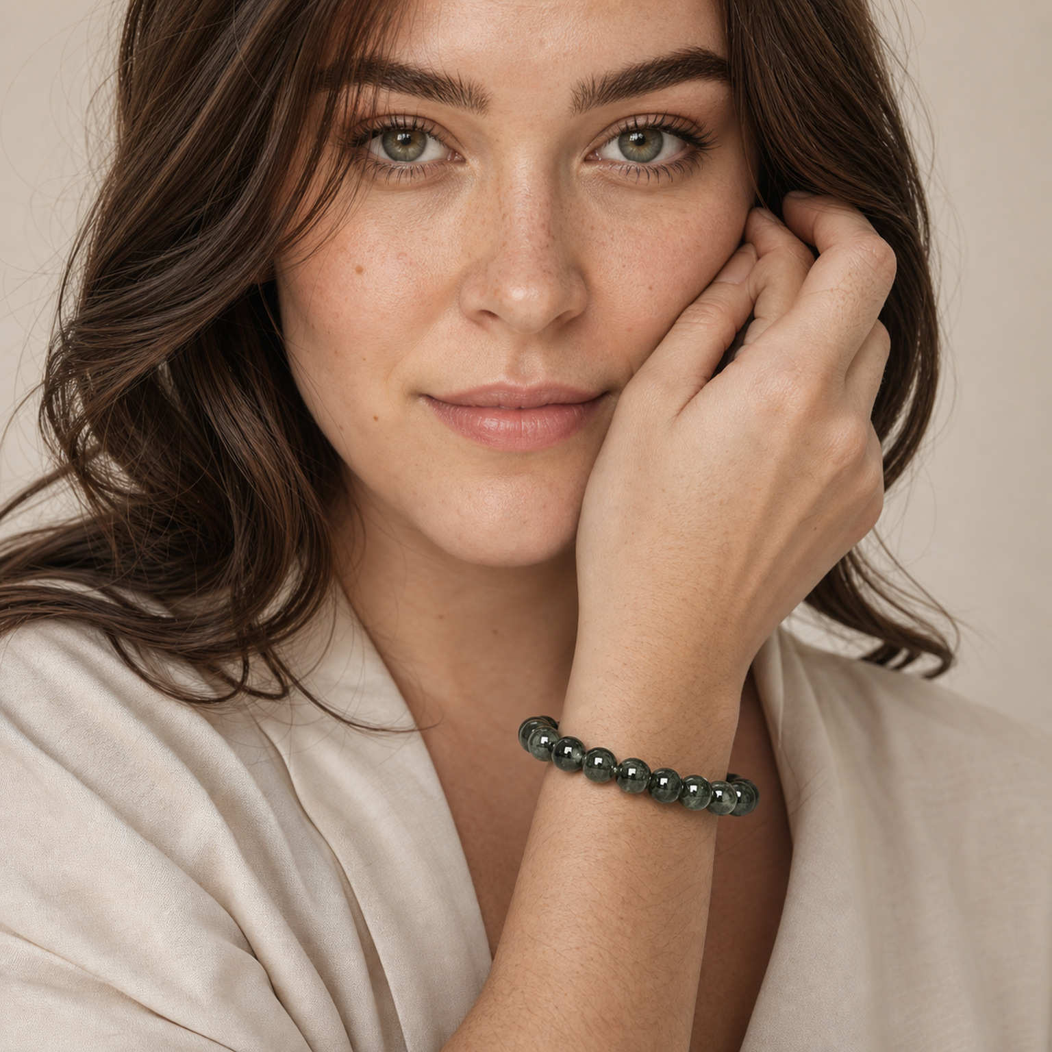 Green Rutilated Quartz worn by a woman with the bracelet in focus