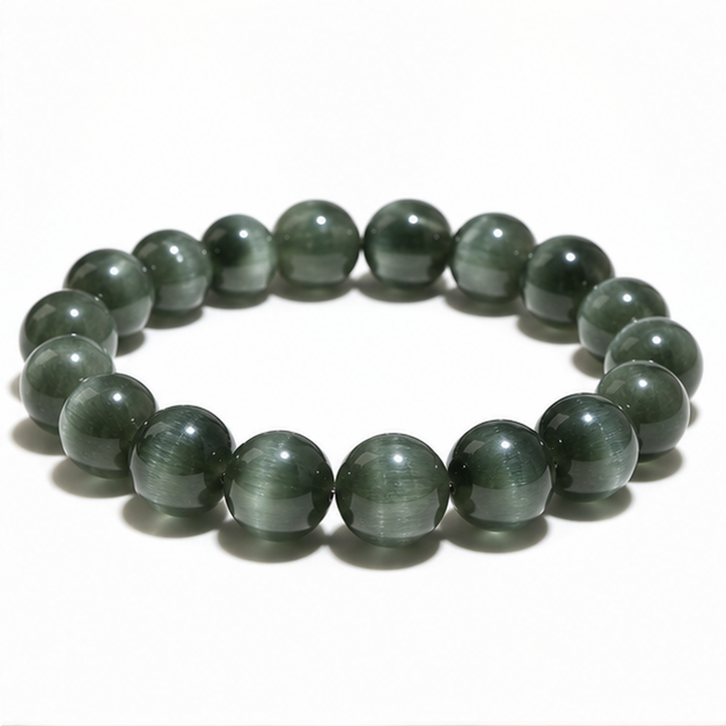 Cat's-Eye Green Rutilated Quartz on a white background