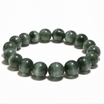 Cat's-Eye Green Rutilated Quartz on a white background