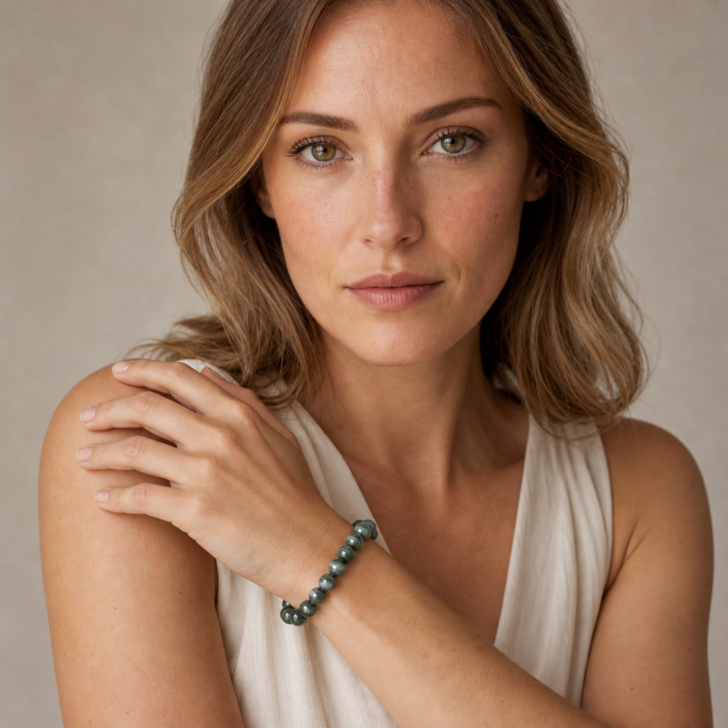 Cat's-Eye Green Rutilated Quartz styled on a woman in a close product view