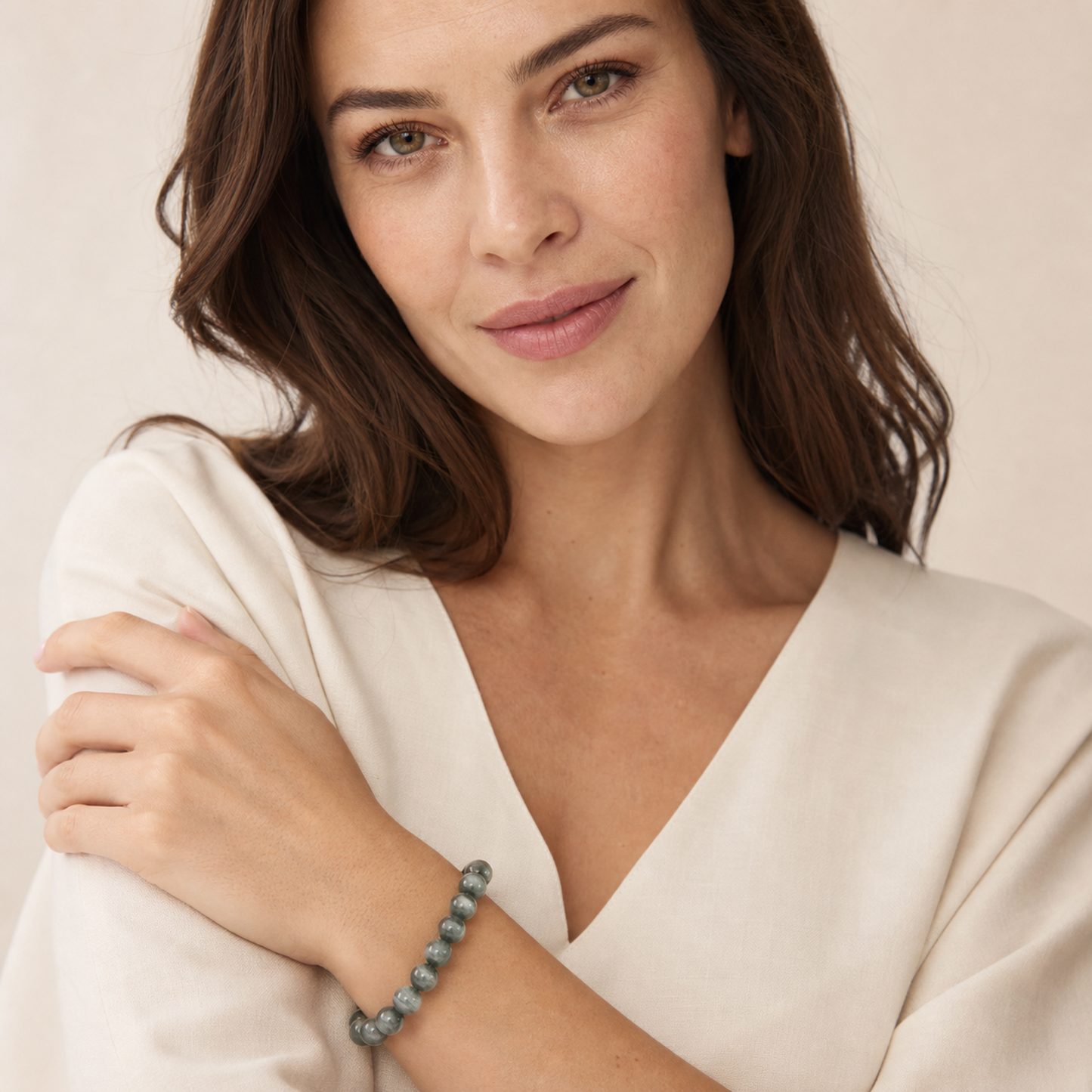 Cat's-Eye Green Rutilated Quartz worn by a woman with the bracelet in focus