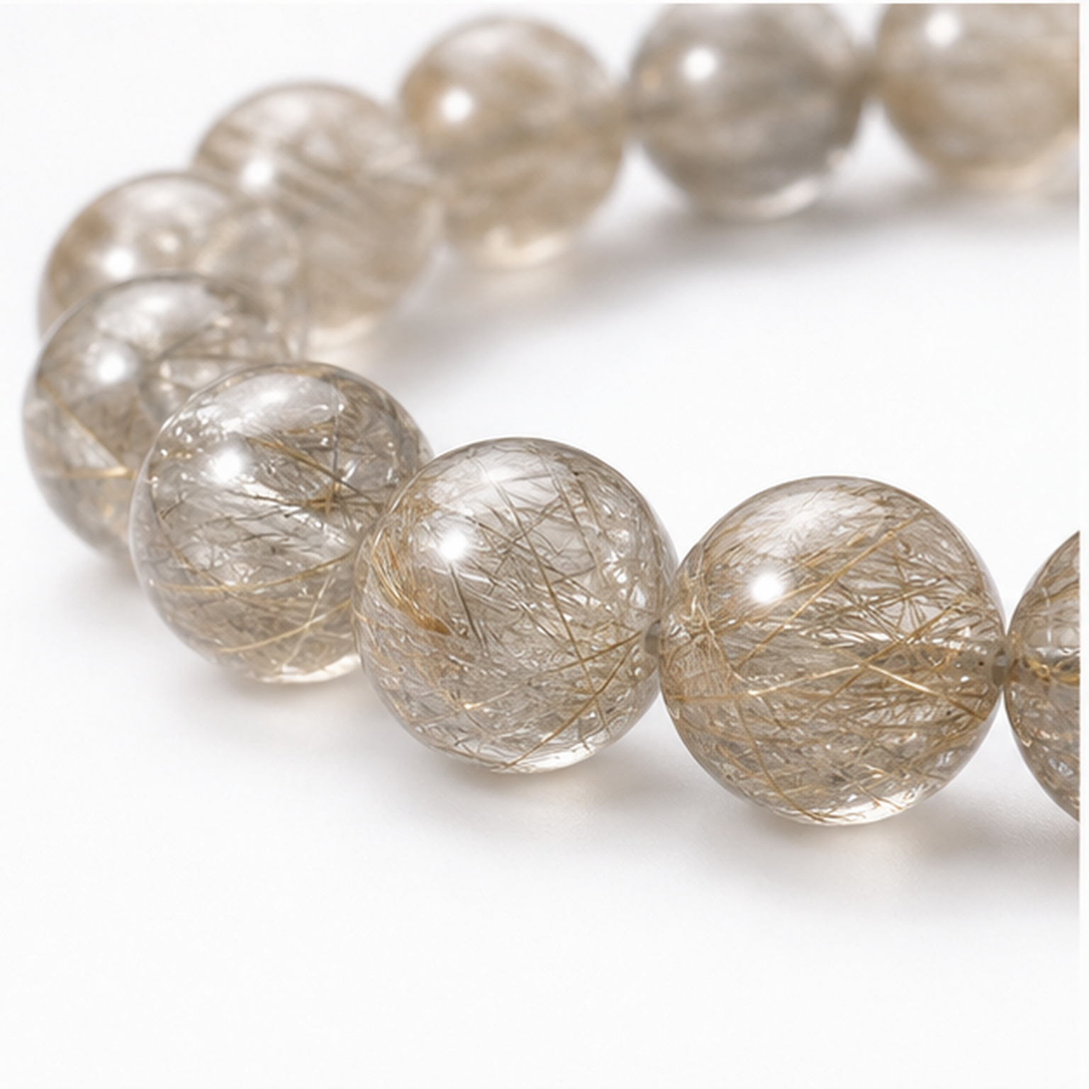 Close-up of Devil's Silver Rutilated Quartz bead colour and surface detail