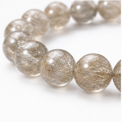 Close-up of Devil's Silver Rutilated Quartz bead colour and surface detail