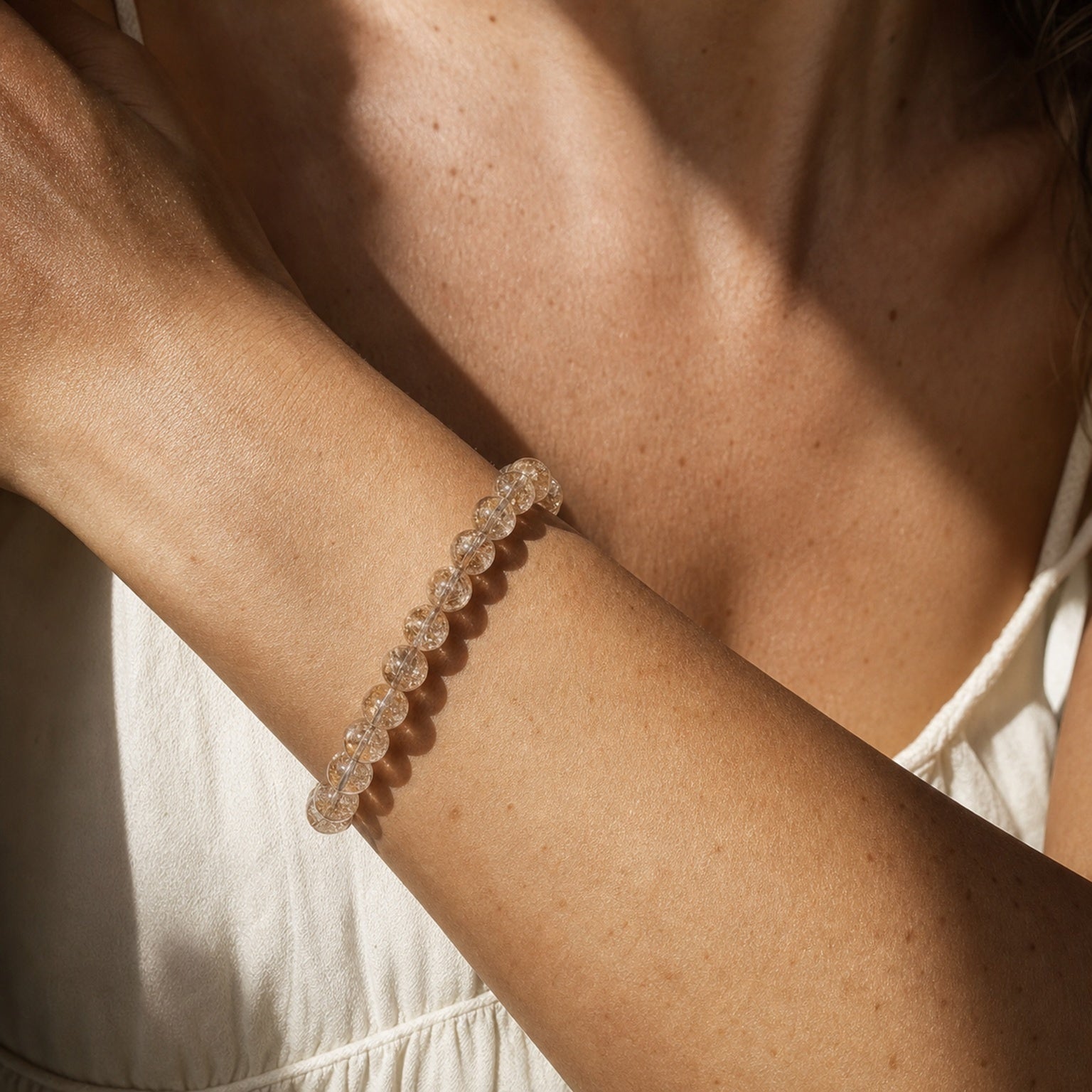 Close wrist detail of Devil's Silver Rutilated Quartz