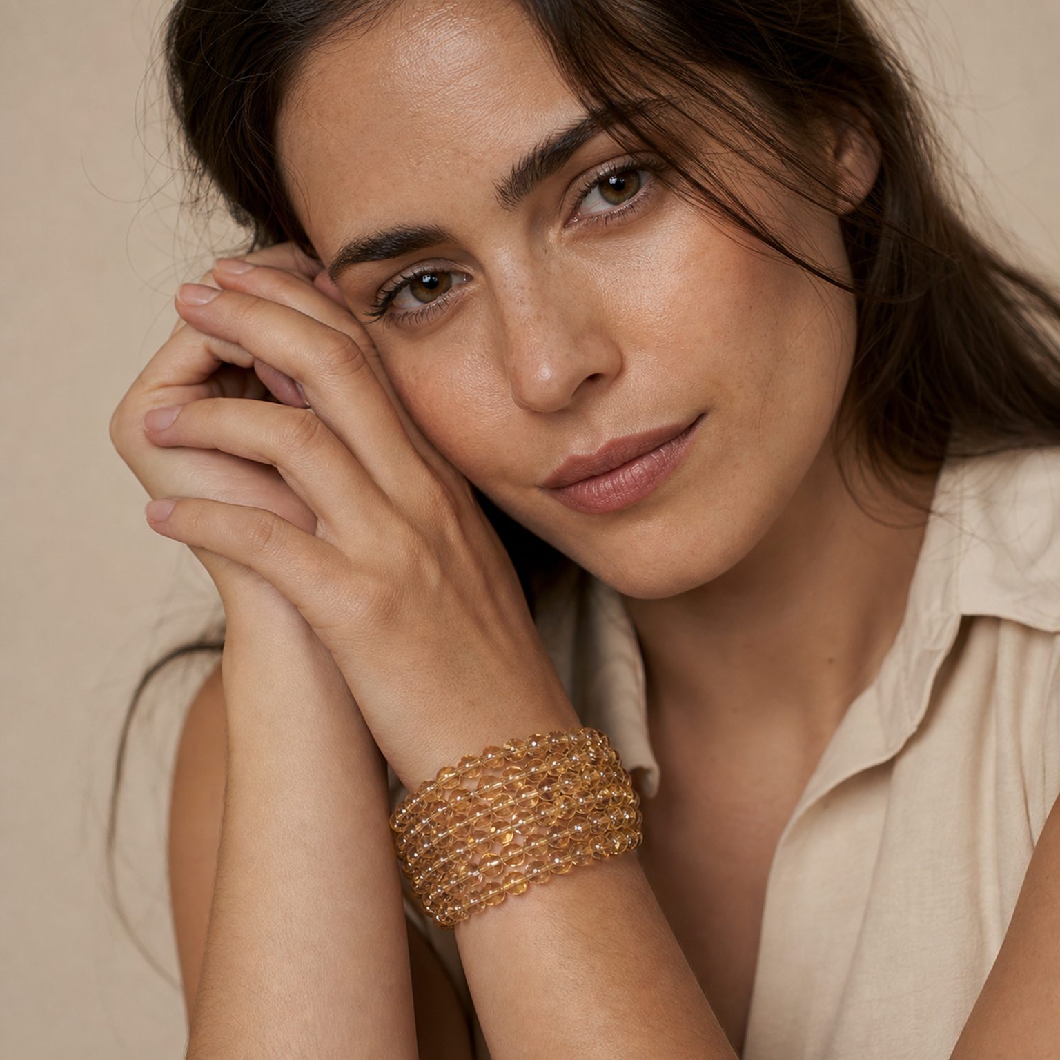 Titanium Rutilated Quartz worn by a woman