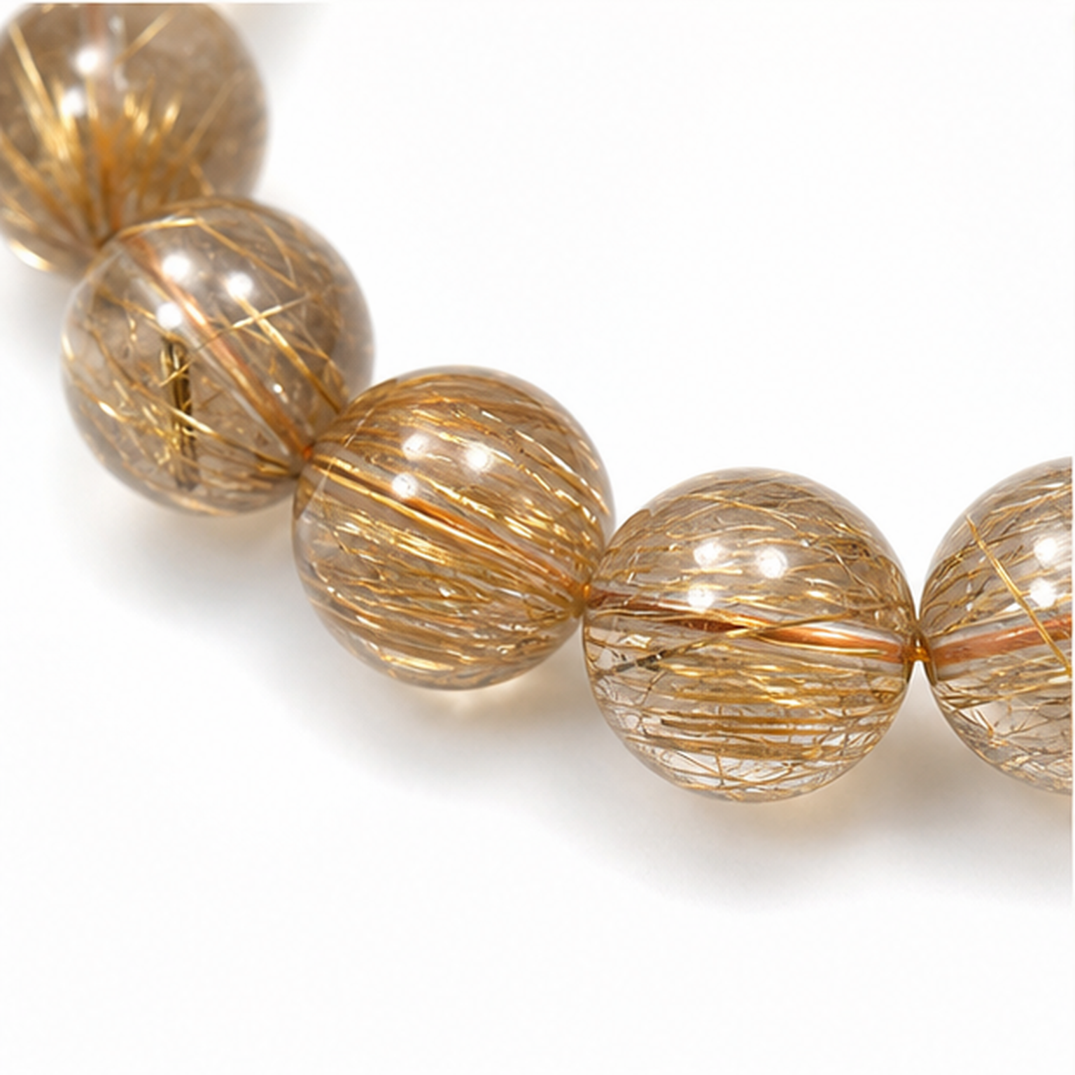 Close-up of Copper Rutilated Quartz bead colour and surface detail