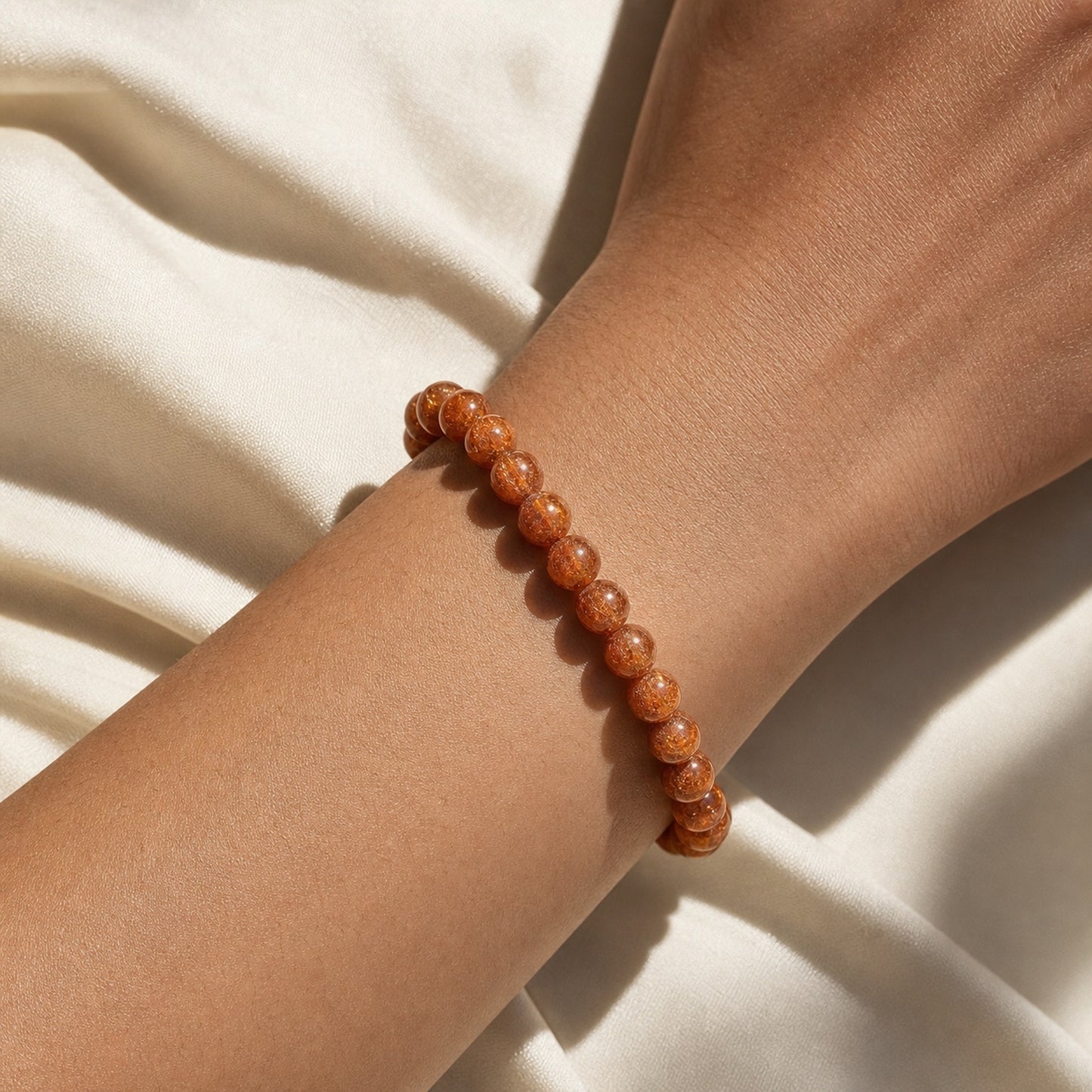 Close wrist detail of Copper Rutilated Quartz